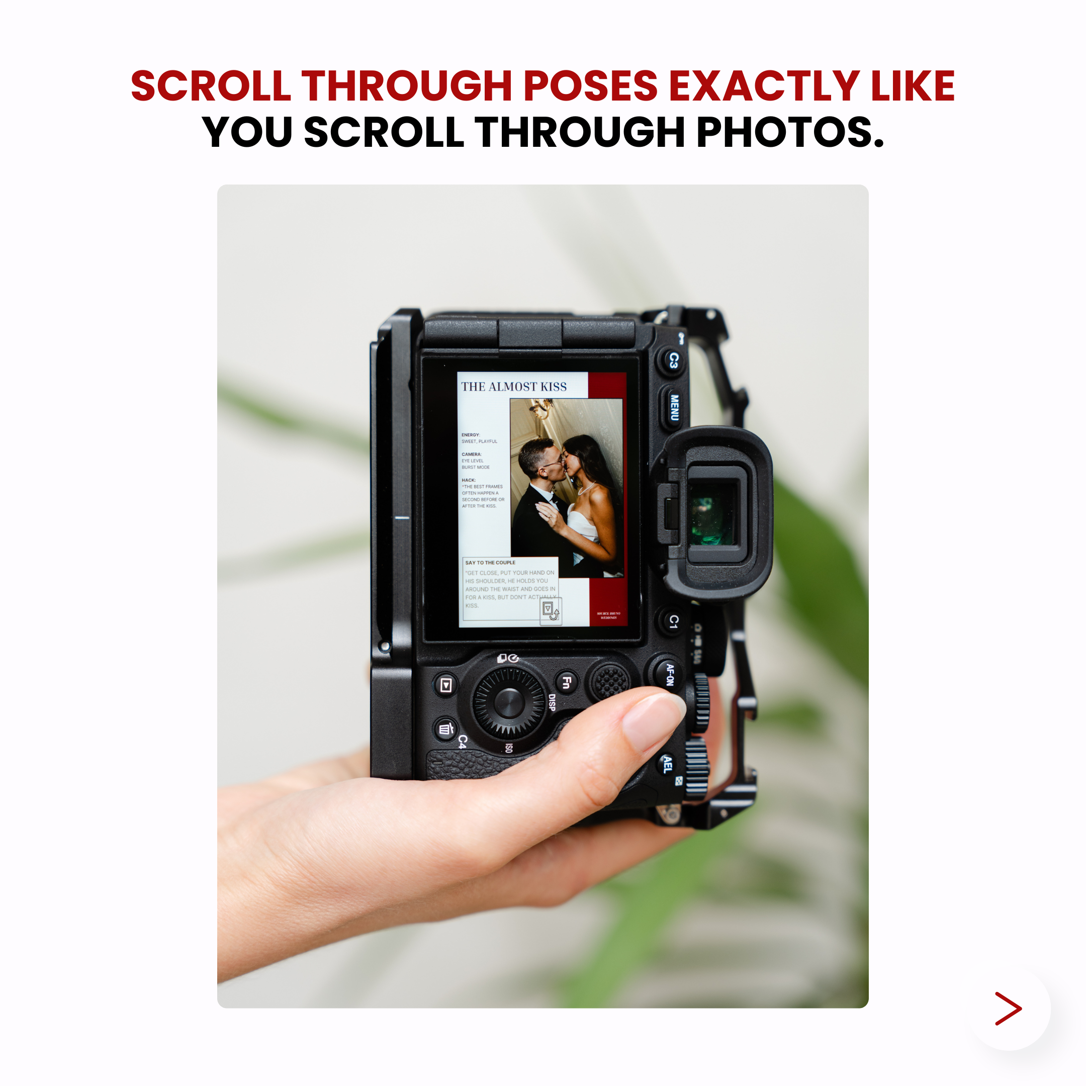 A person holding a camera with a photo of a kissing couple displayed on the screen.
