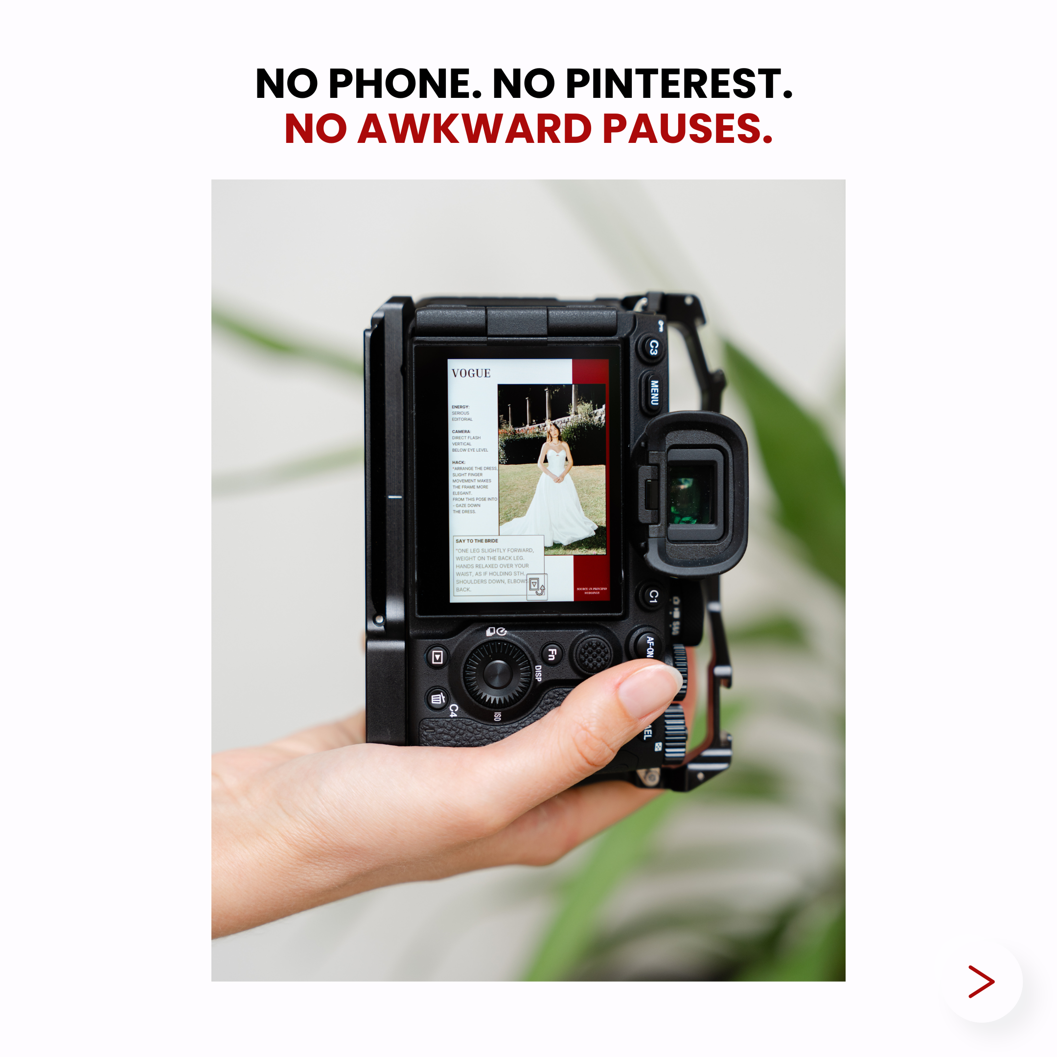A person holding a camera with a wedding photo displayed on the screen.