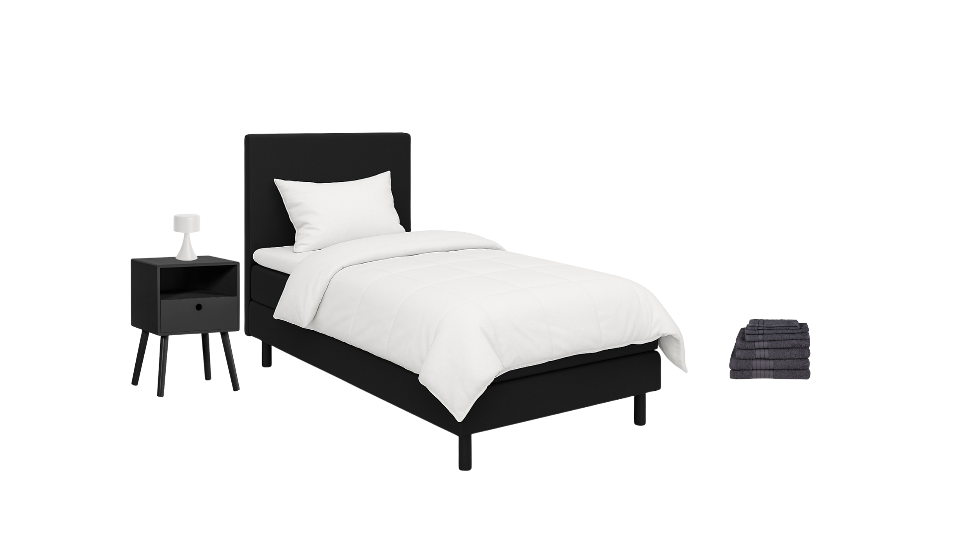 Minimalist bedroom with a black bed frame and headboard, white bedding, pillow, and blanket, situated next to a black nightstand with a white lamp and a small drawer, and a stack of dark towels on the floor.