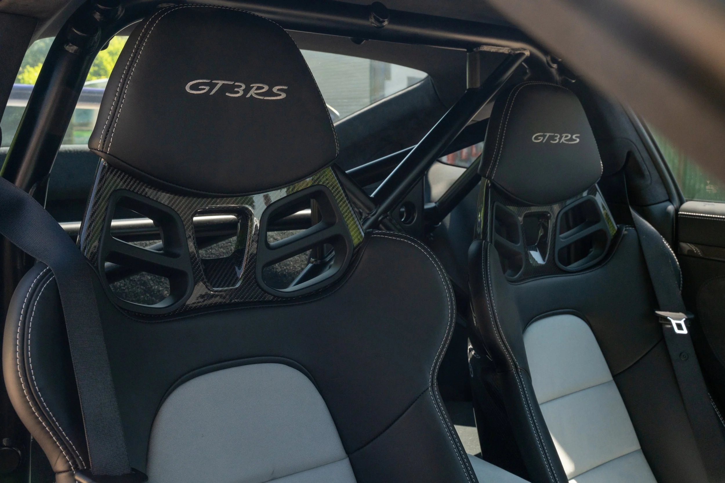 The interior of a Porsche GT3 RS, showing two racing seats with 