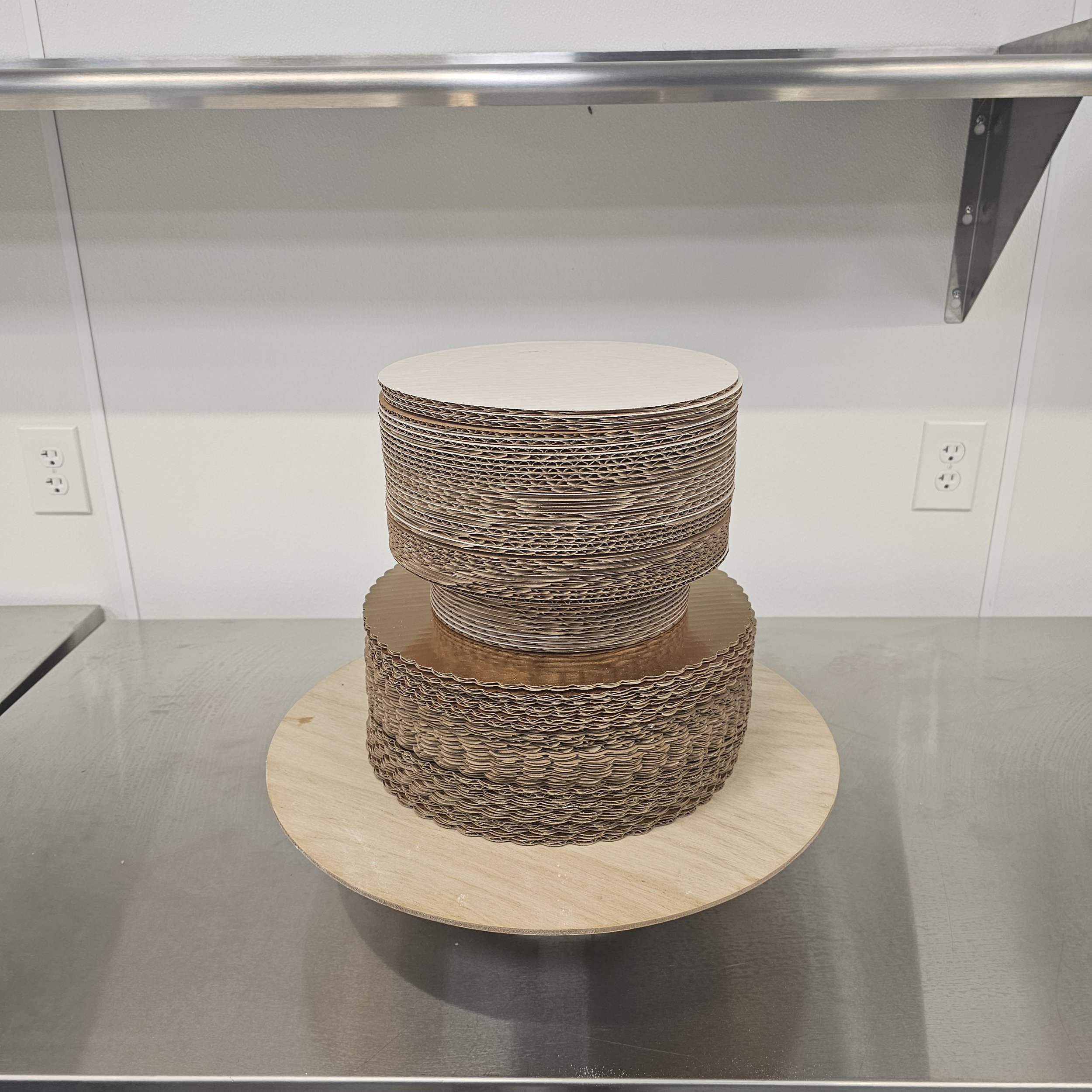 A Pokémon-themed birthday cake featuring a large image of Charmander, with orange, red, yellow, and blue decorations, and the words "Happy Birthday Darren" written in blue icing.