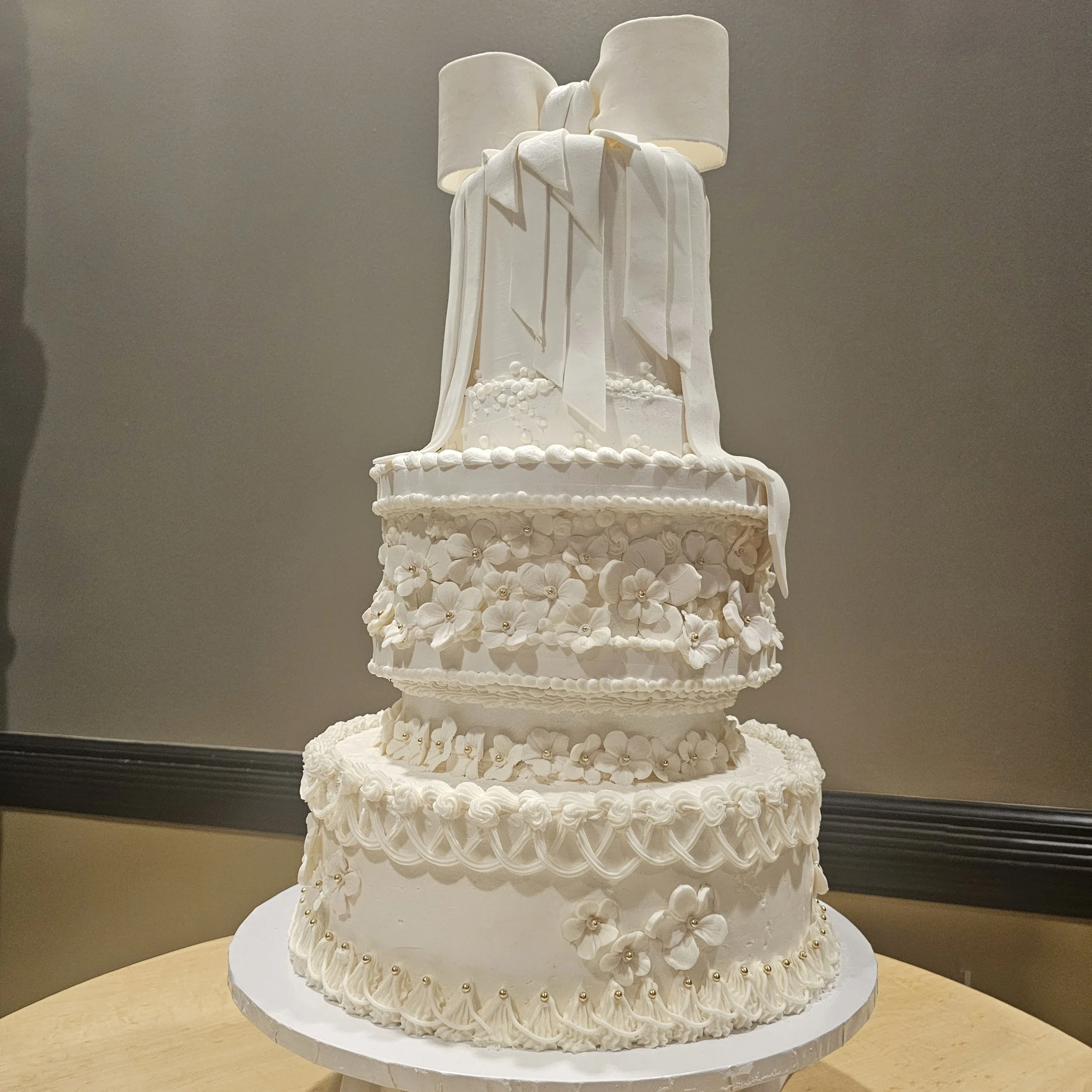 Black and gold birthday cake with chocolate Oreos and yellow drizzle, celebrating Asia's 14th birthday.