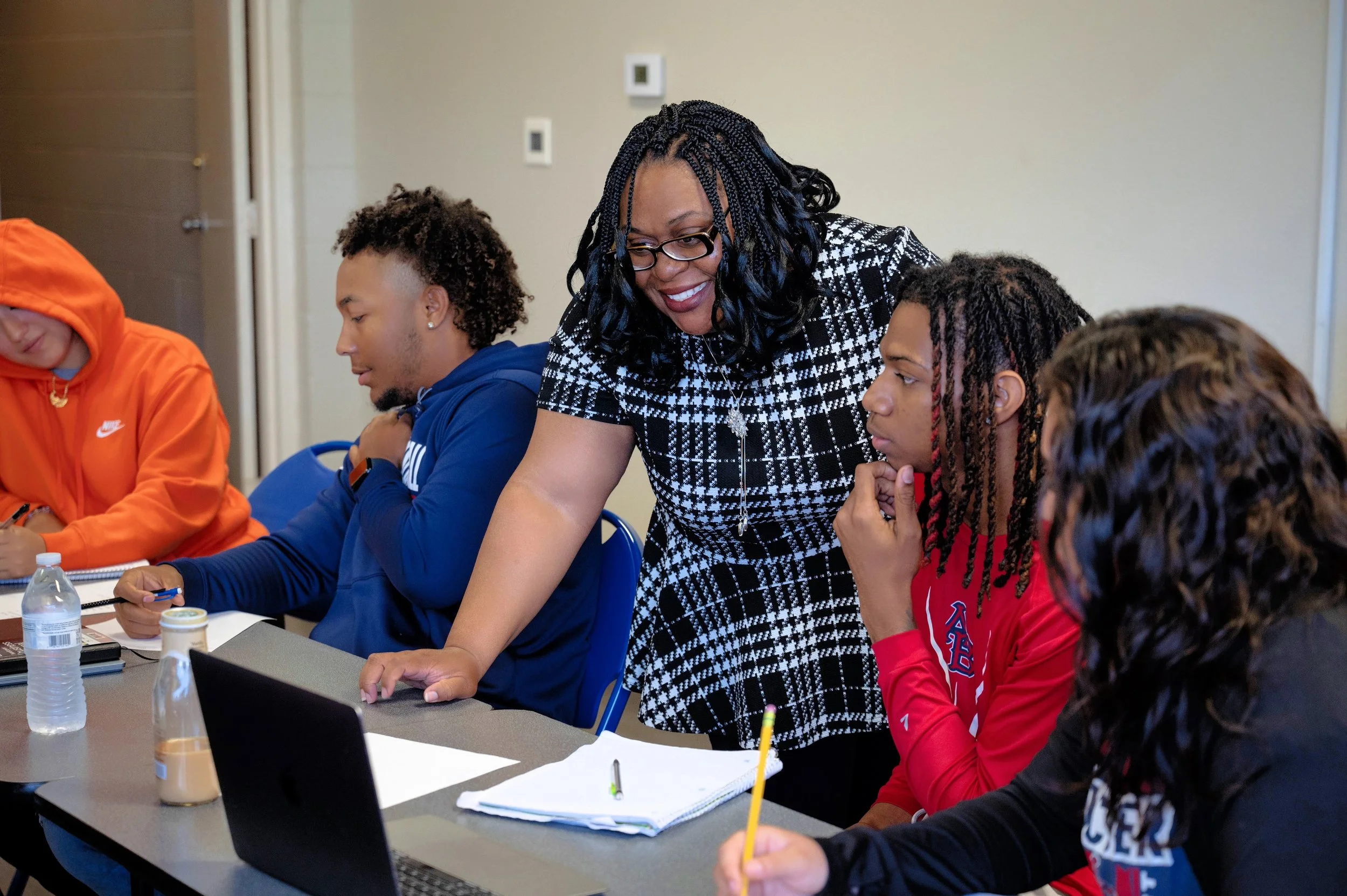 Classroom_teacher helping 4students_5.jpg