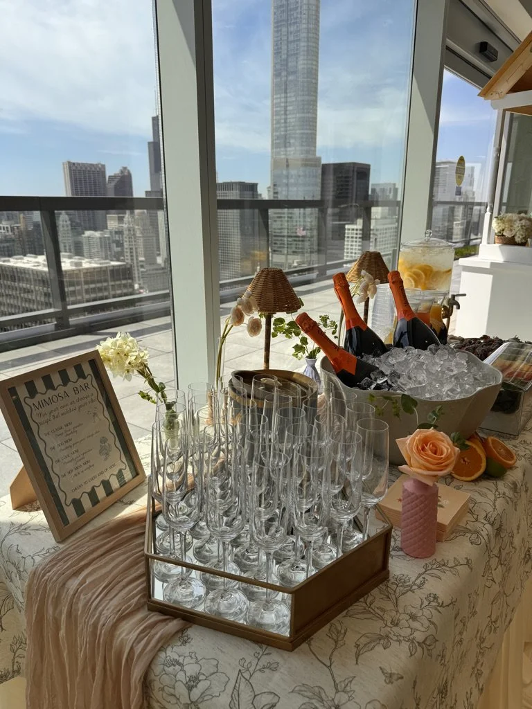 Mimosa bar styled by a Chicago event planner, with a city skyline view