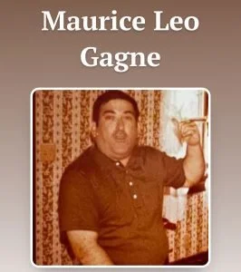 A man in a dark polo shirt raising his left arm, standing in front of patterned curtains, with his name 'Maurice Leo Gagne' written above him in white text.