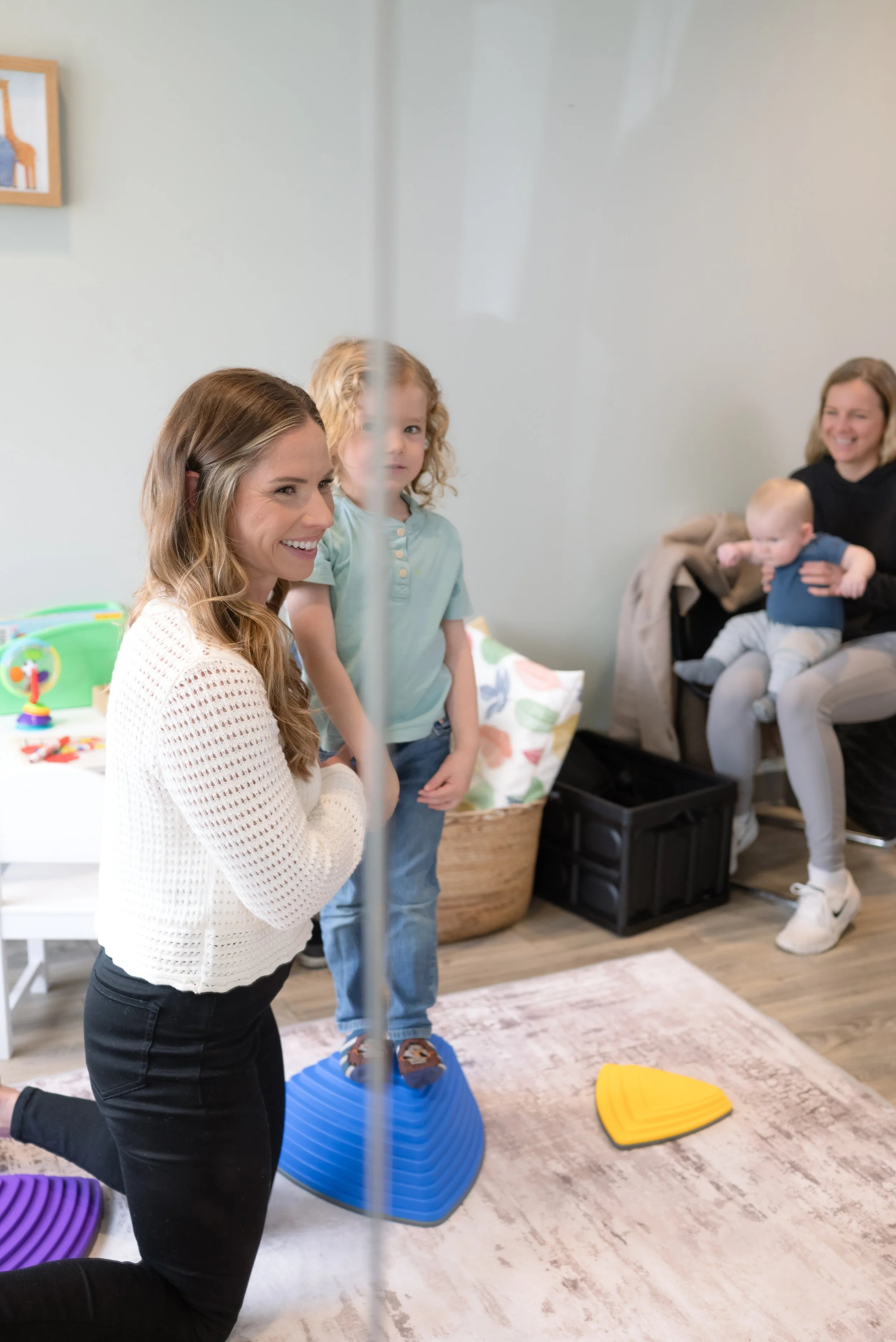 Pediatric milestone assessment session at Nurture 360, supporting reflex integration and balance coordination.
