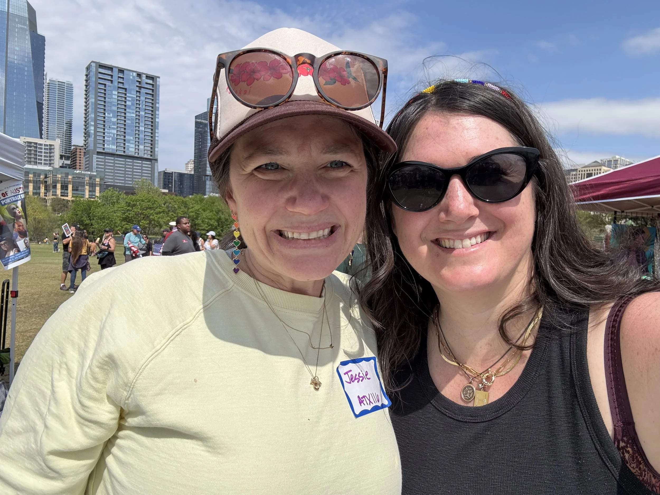 Co-founders Heather and Jessie tabling at Community Care Village during No Kings Day 2026