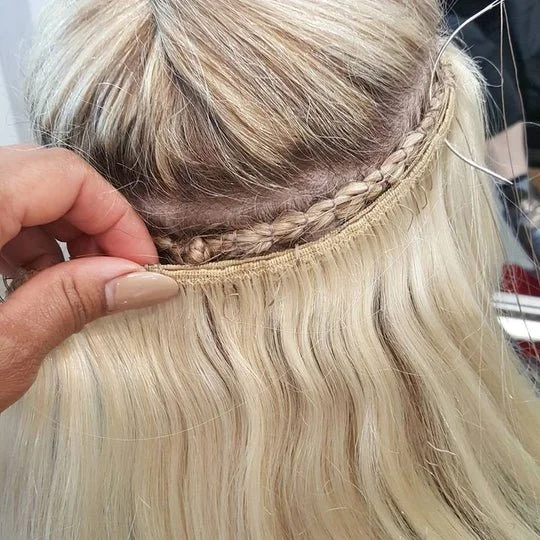 Salty Locks Genius Weft hair extensions sewn into braided natural hair for secure, long-lasting volume.