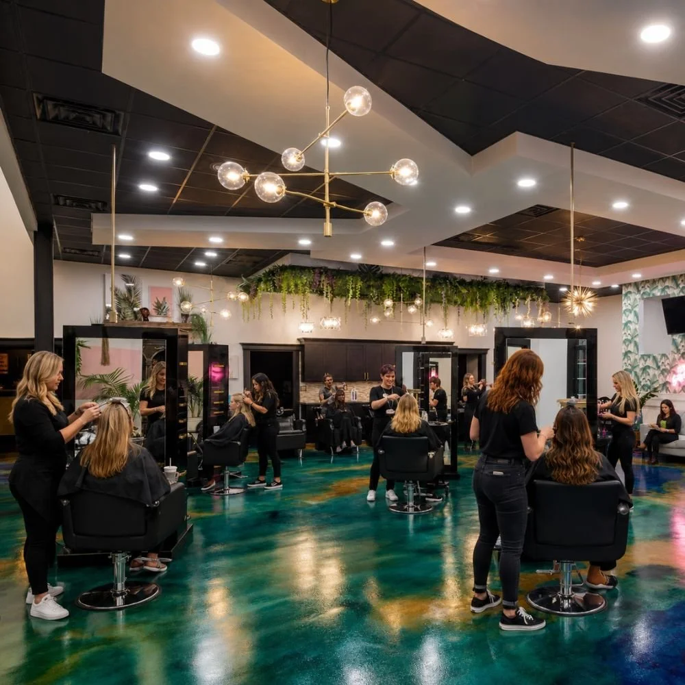 Stylists providing hair color, balayage, haircut, extensions, and styling services inside Studio 285 Hair Salon in Evans, Georgia.