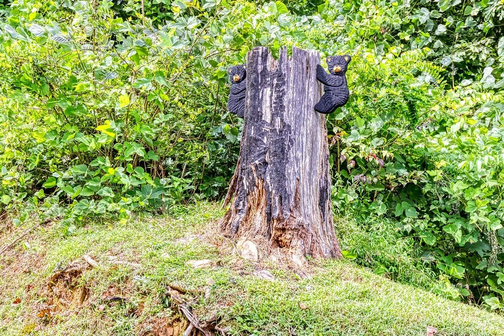 Living Color Cabin tree with two small bear statues attached.