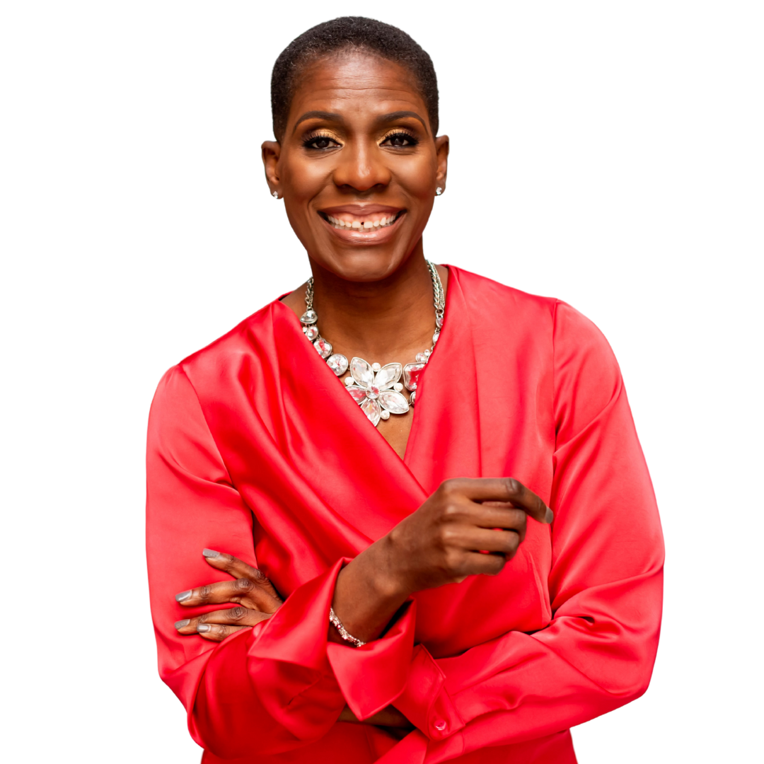Portrait of a smiling woman, Leslie Marant, with short hair wearing a red dress and jewelry, standing with arms crossed.
