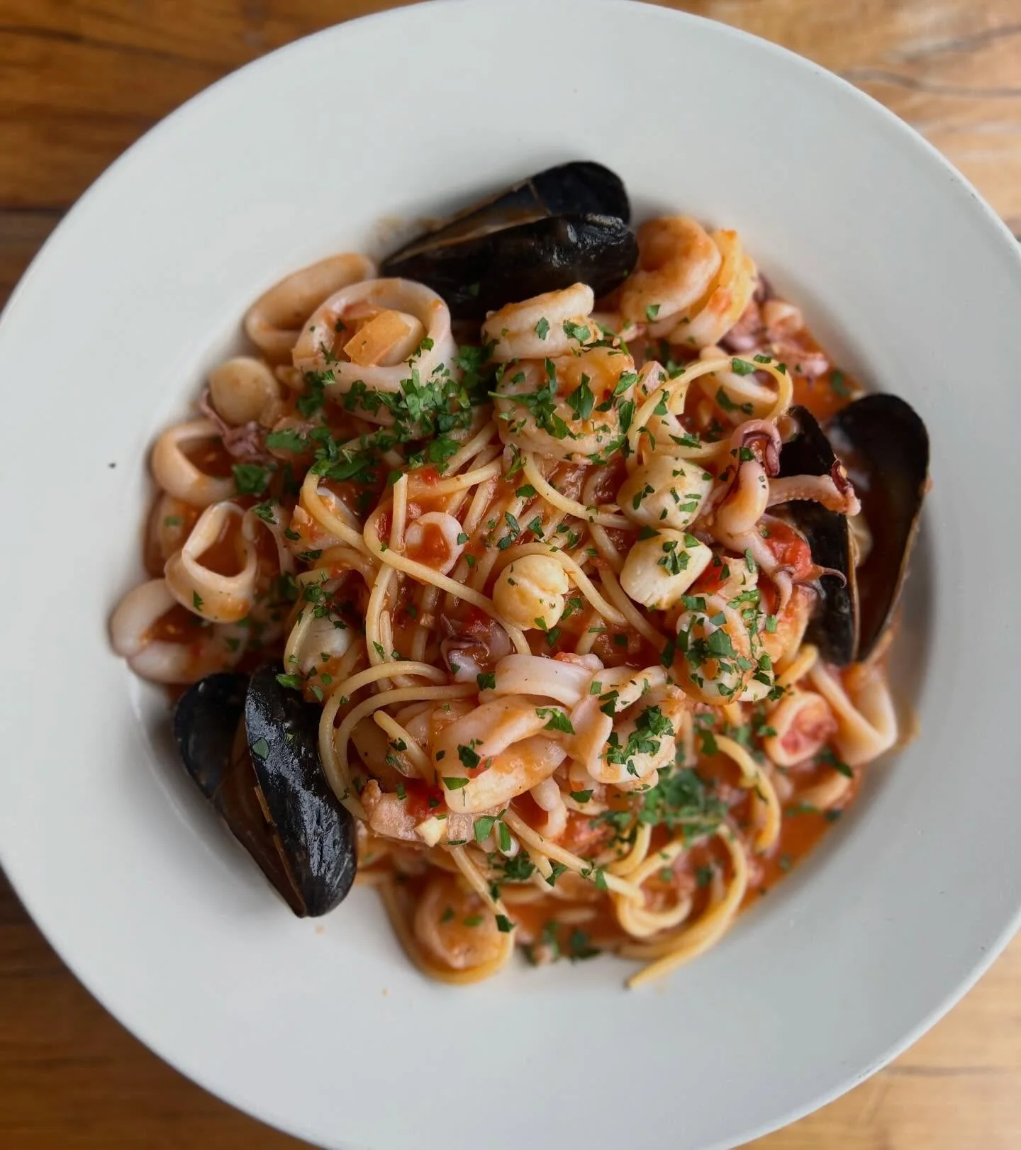 Pasta con frutti di mare mantecato con aglio scalogno e pomodoro. 

Frutti di mare - literally translating to &ldquo;fruit of the ocean,&rdquo; a classic Italian dish bay scallops, shrimp, mussels and calamari, tossed in a sauce of garlic, shallots a