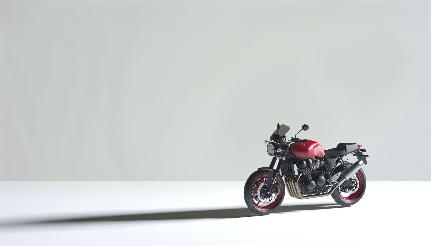 A modern red and black motorcycle parked on a white surface, casting a shadow against a light gray background.