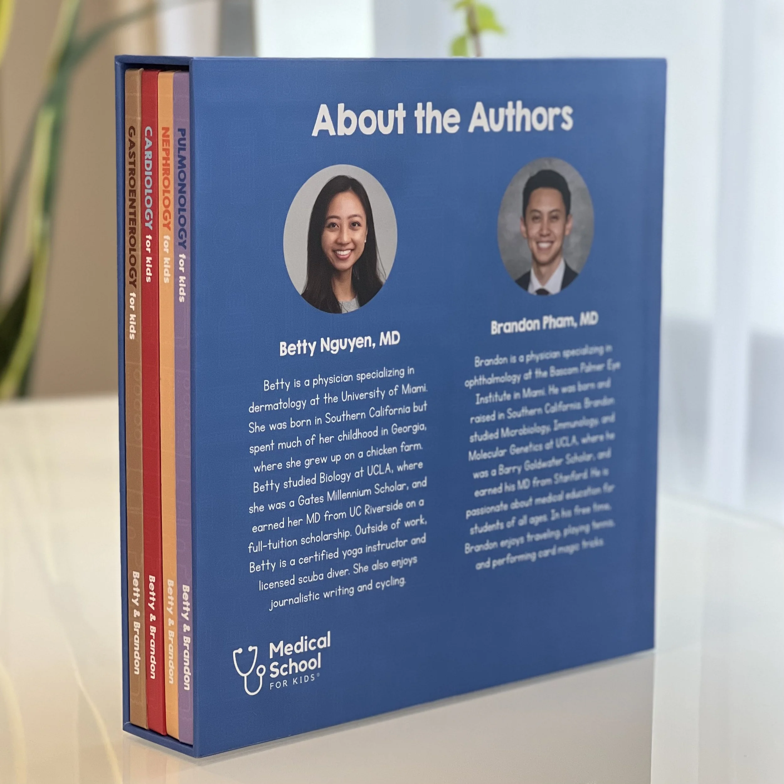 Book about authors Betty Nguyen and Brandon Pham, MD, with their portraits and biography, labeled 'About the Authors', set on a white surface with a plant in the background.