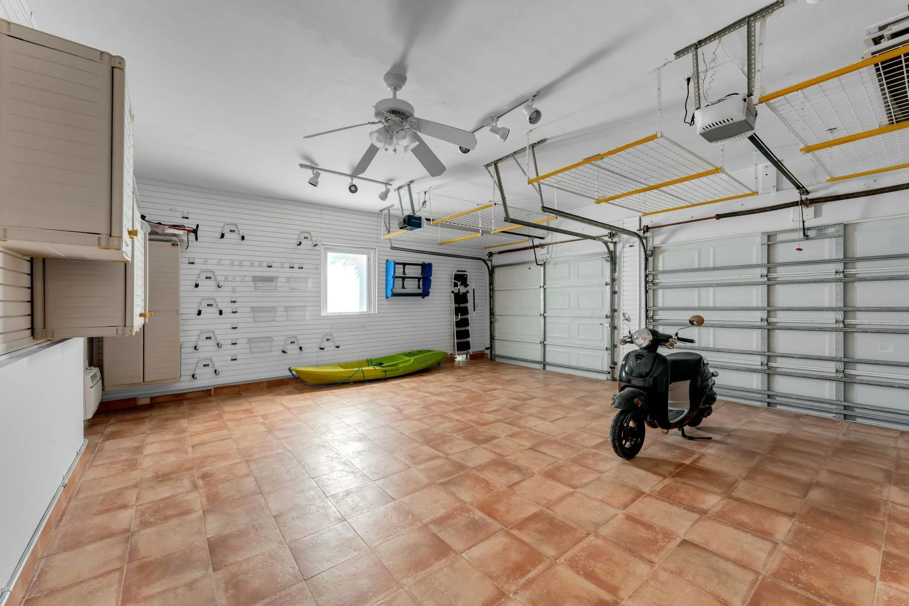 2 1/2 Car Garage: Equipped with GARAGE TEK storage system, A/C, new garage door motors