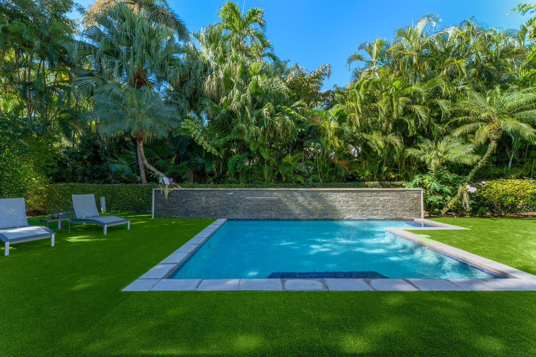 Heated pool with waterfall
