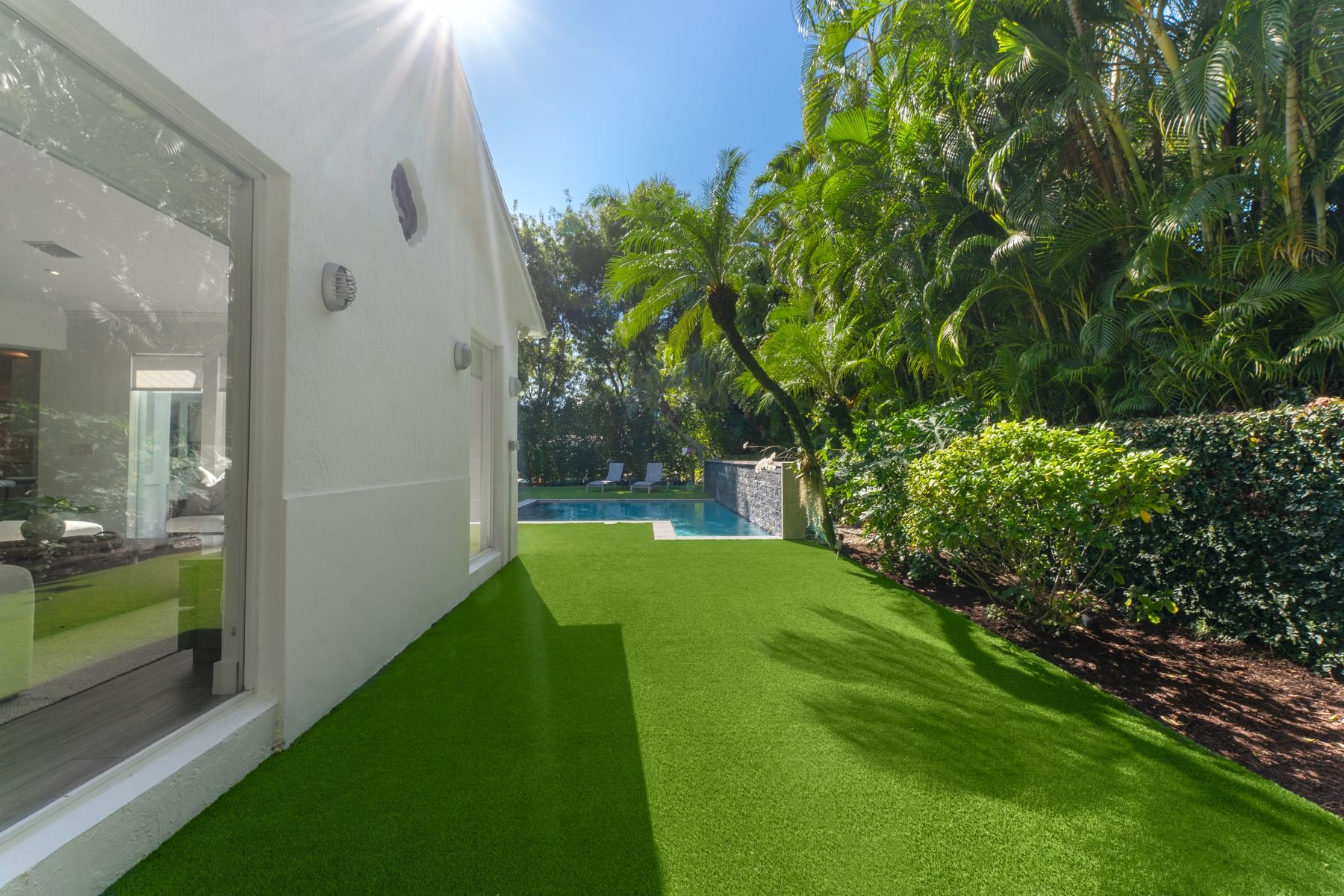 Side yard leading to pool area