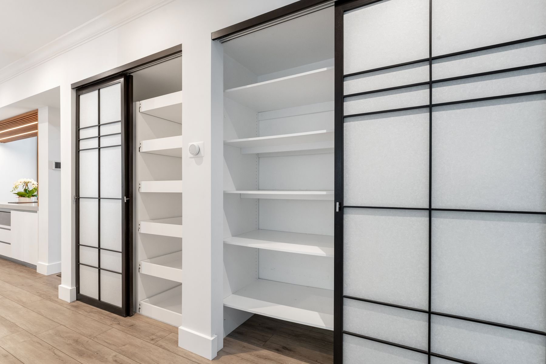 Exceptional Pantry and storage areas; sliding Shoji paper and walnut doors