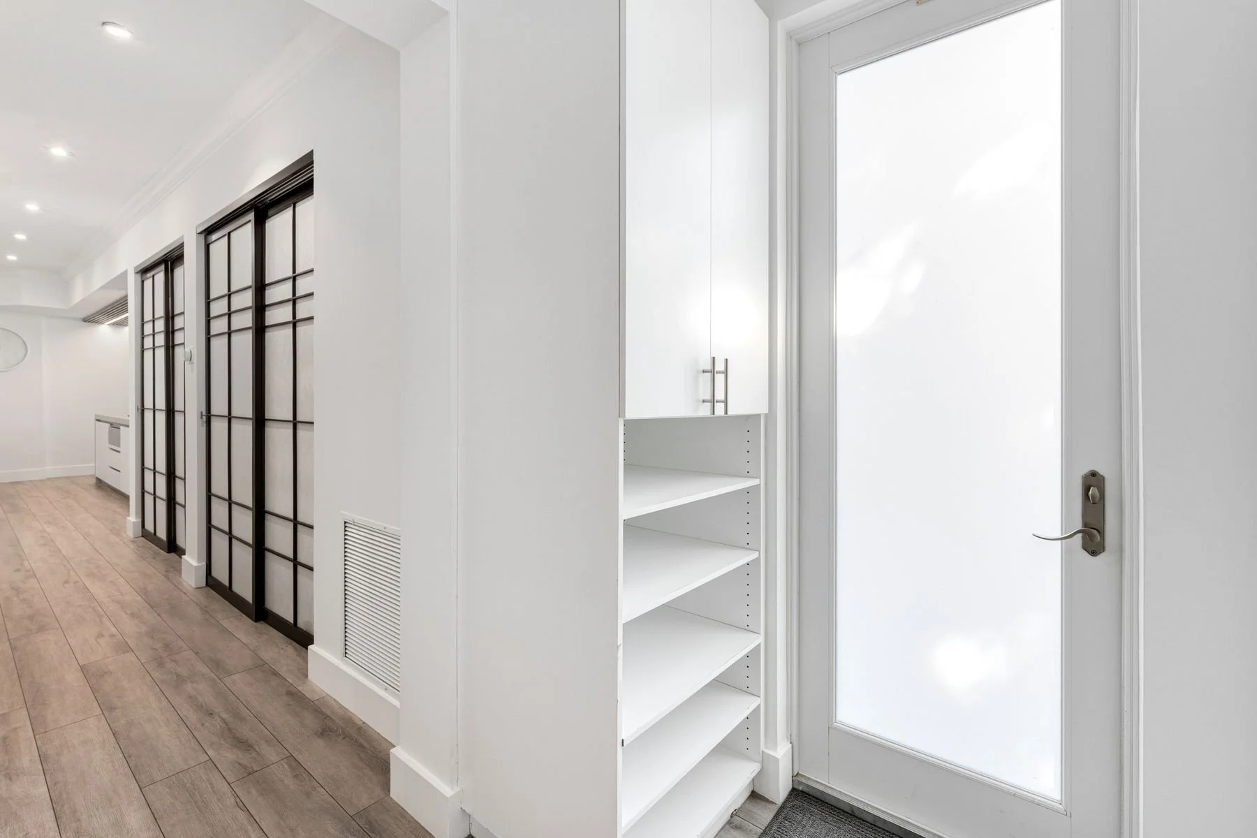 Mudroom (with separate side entrance into house) and custom shoe closet