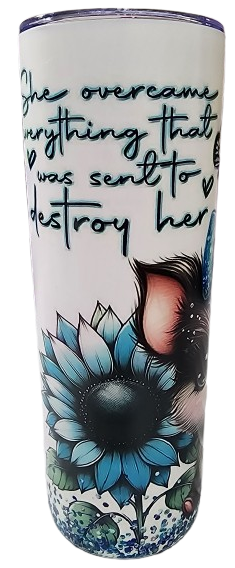 A tumbler with a quote and floral design. The quote says, 'She overcame everything that was sent to destroy her,' written in black cursive and print handwriting.