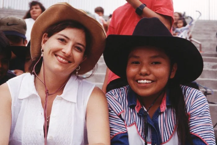 Justine talks with a young Navajo woman