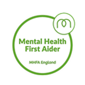 MHFA England logo: two mirrored green arches forming an abstract M above the words ‘MHFA England’ in a clean sans-serif font