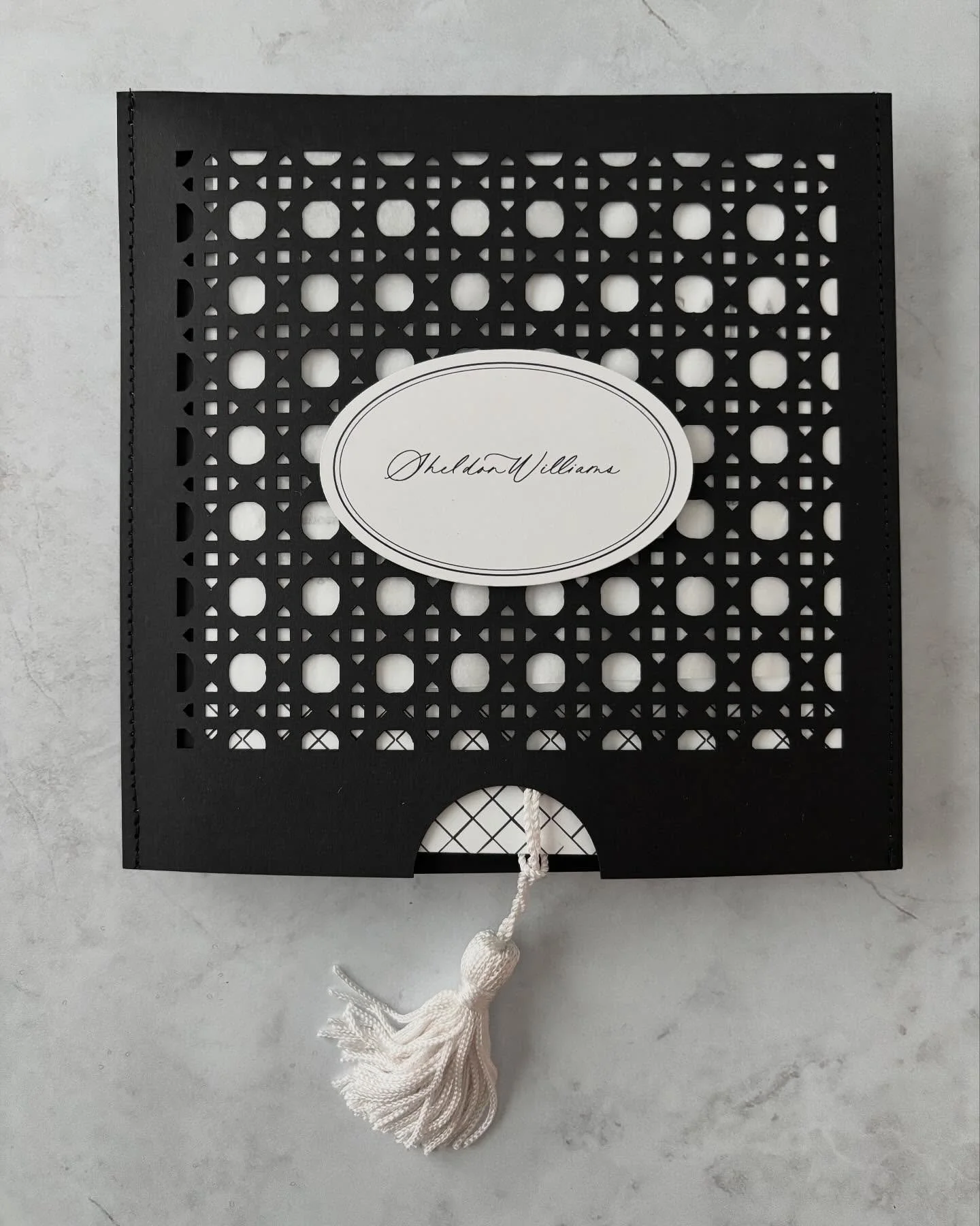 Black, white and rattan. These menus for @eden.g.berry were too good. The personalized pockets were laser cut then stitched together by my hubby, @scotteggleston ! The three piece menu was grommeted and tassels with the tassel indicating their table 