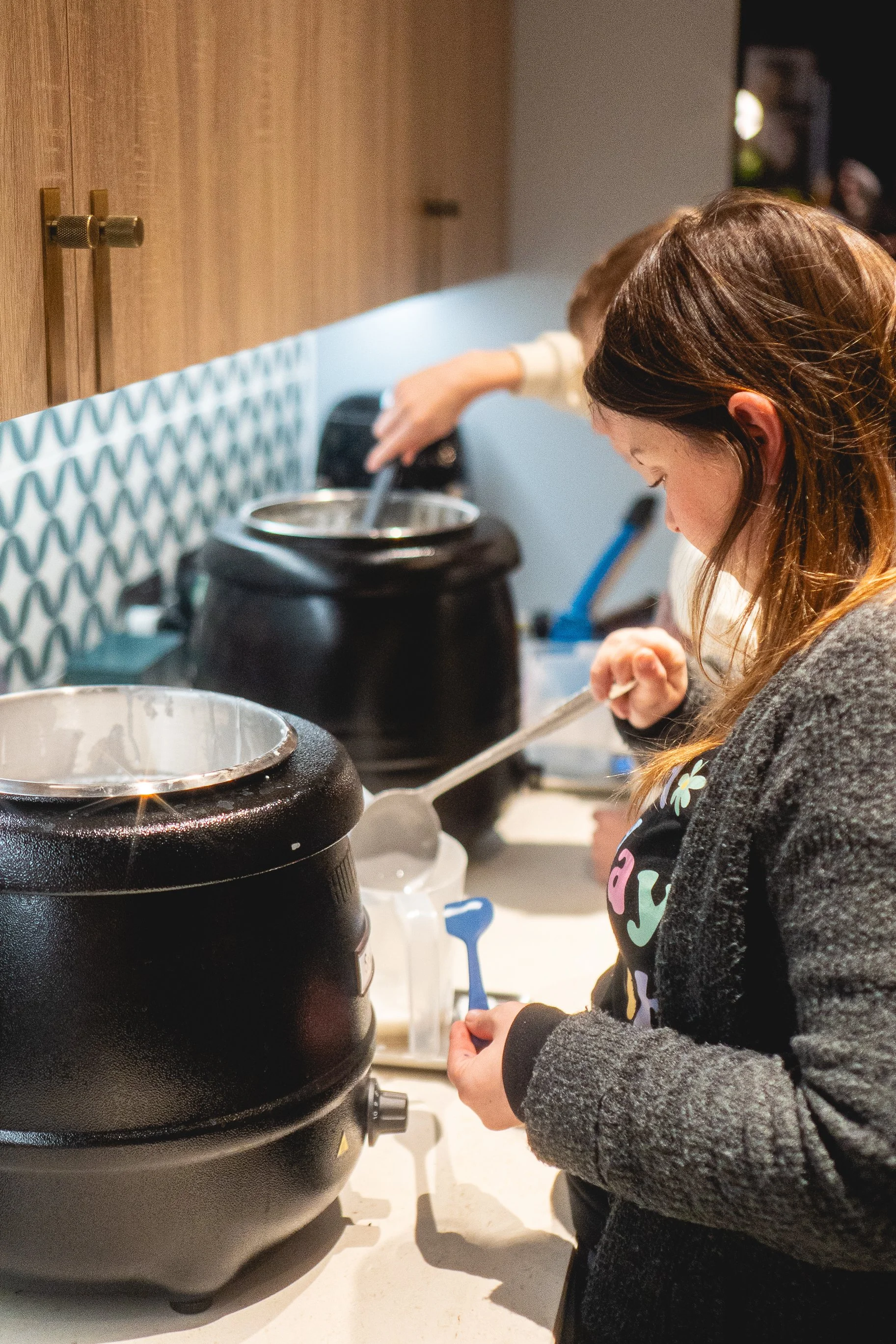 woman pouring soap at private corporate workshop in sussex