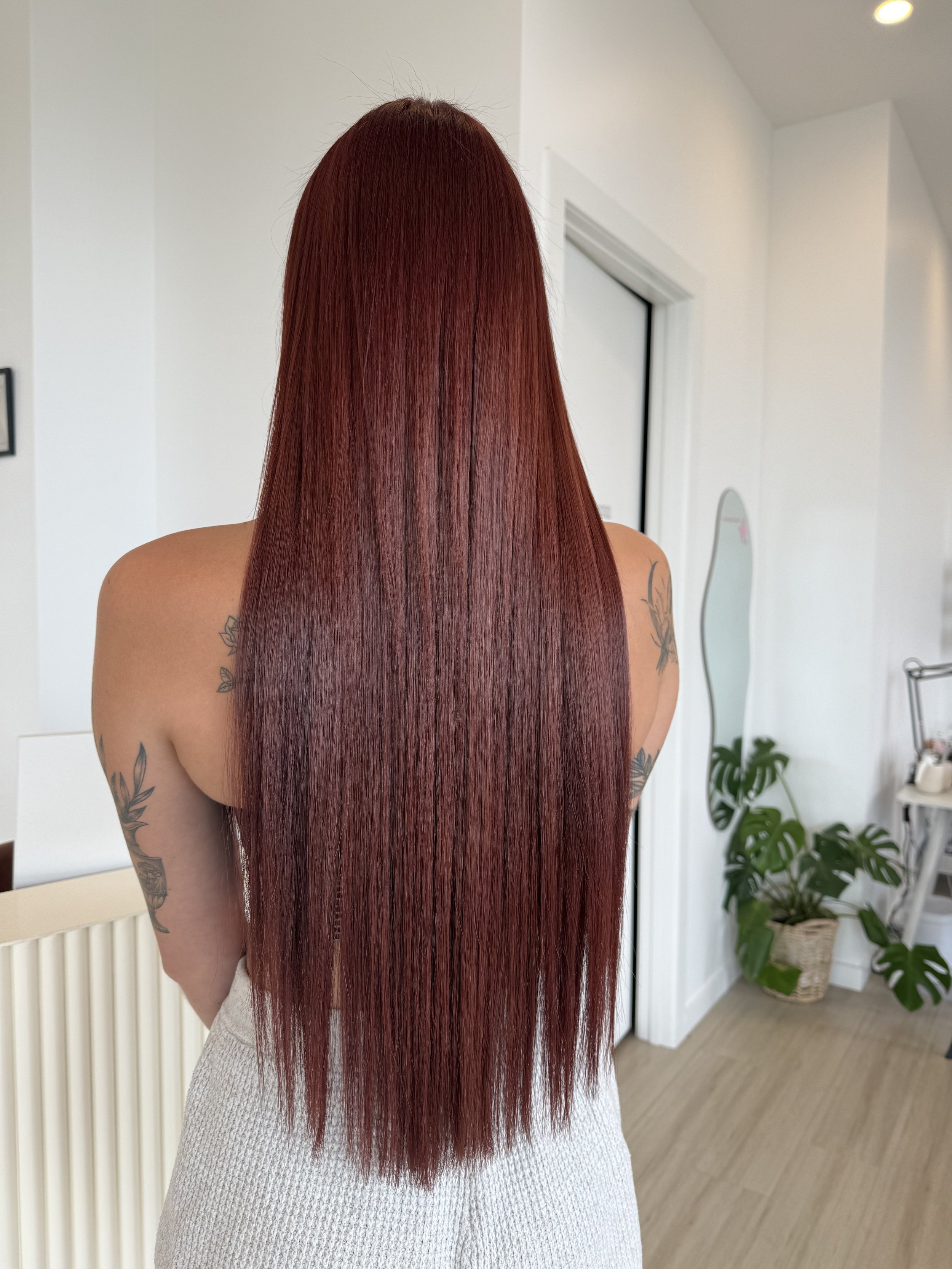 Long straight red hair with extensions