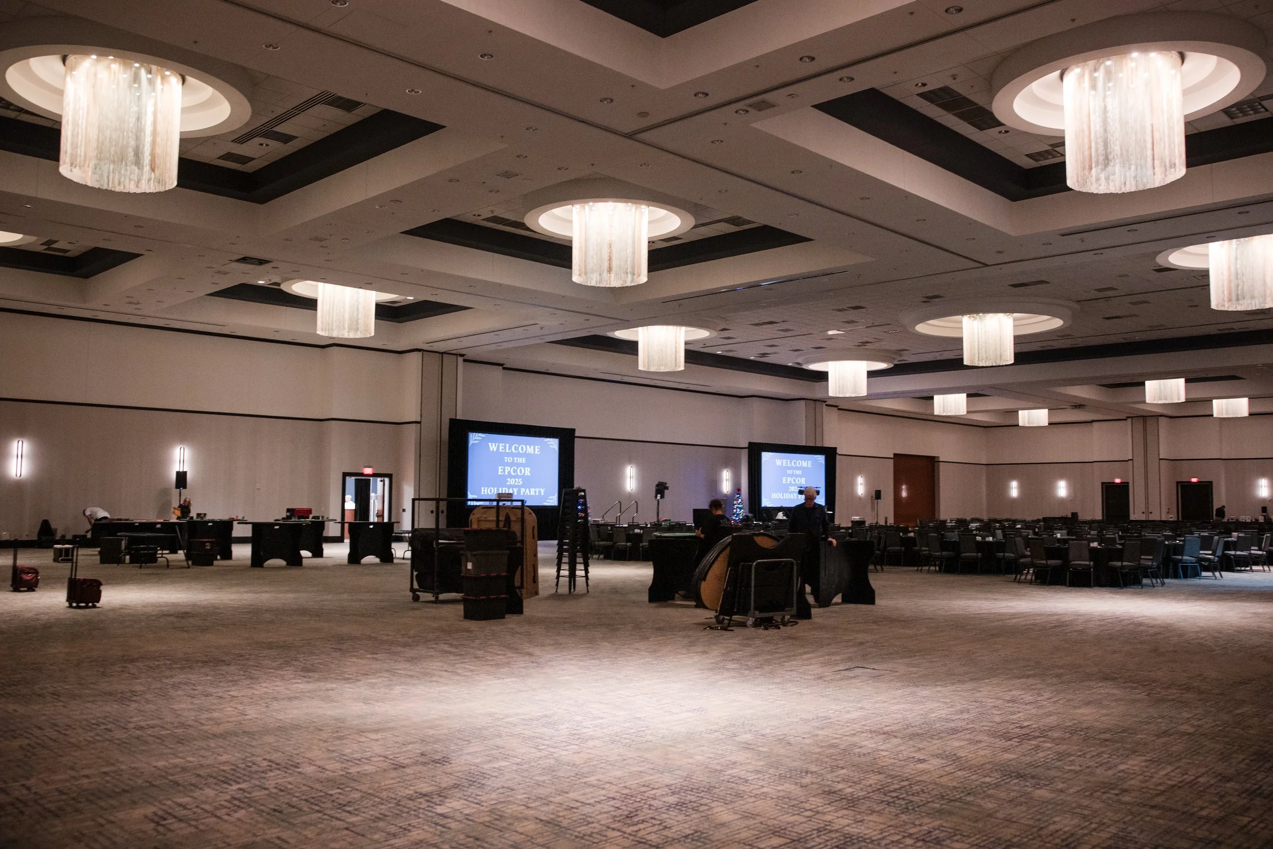Expansive ballroom event setup prepared for corporate event with custom DJ sound, staging, and production support by DJ Bam.