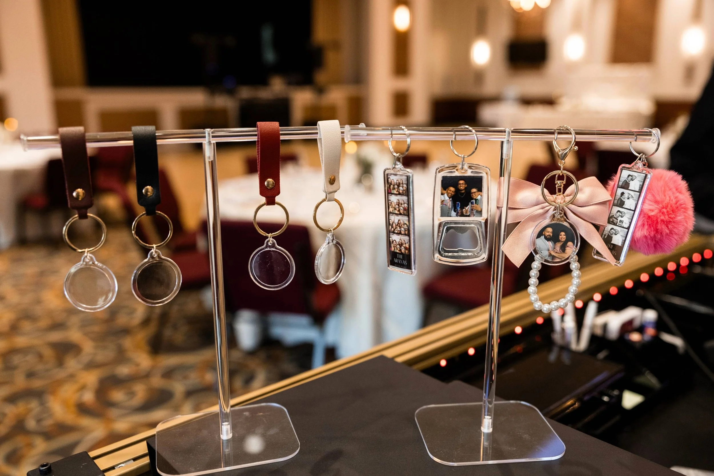 Unique photo booth keepsakes and specialty enhancements including custom keychains and creative designs for standout event experiences by Patty’s Pix.