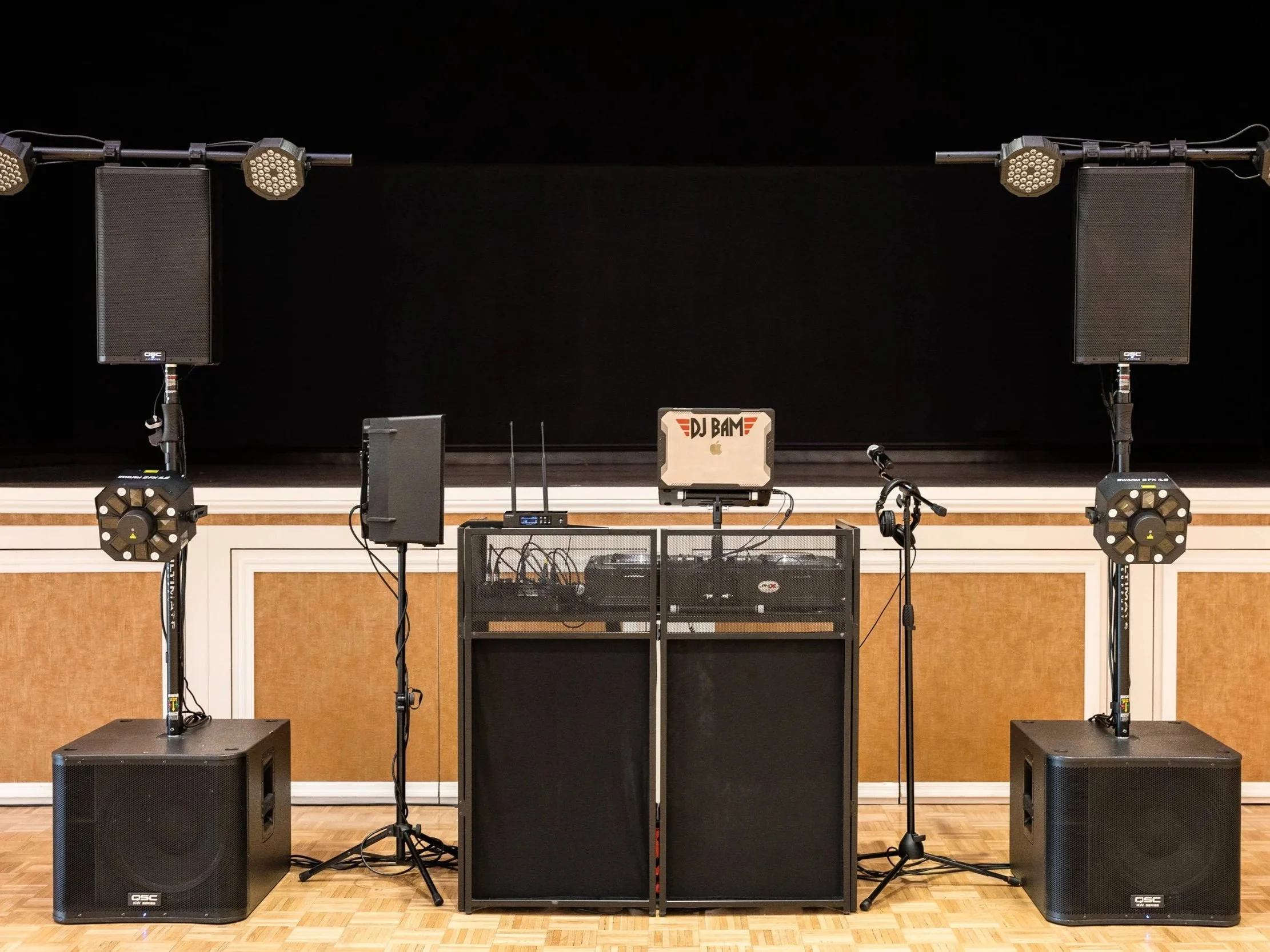 Full-scale DJ sound system with speakers, subwoofers, and lighting for large events and reception venues by DJ Bam.