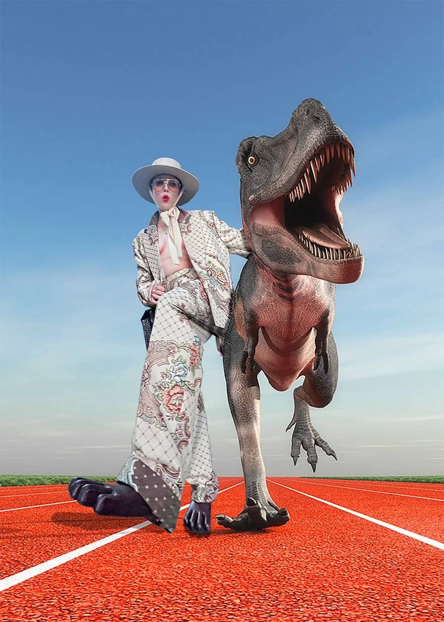 woman next to a dinosaur