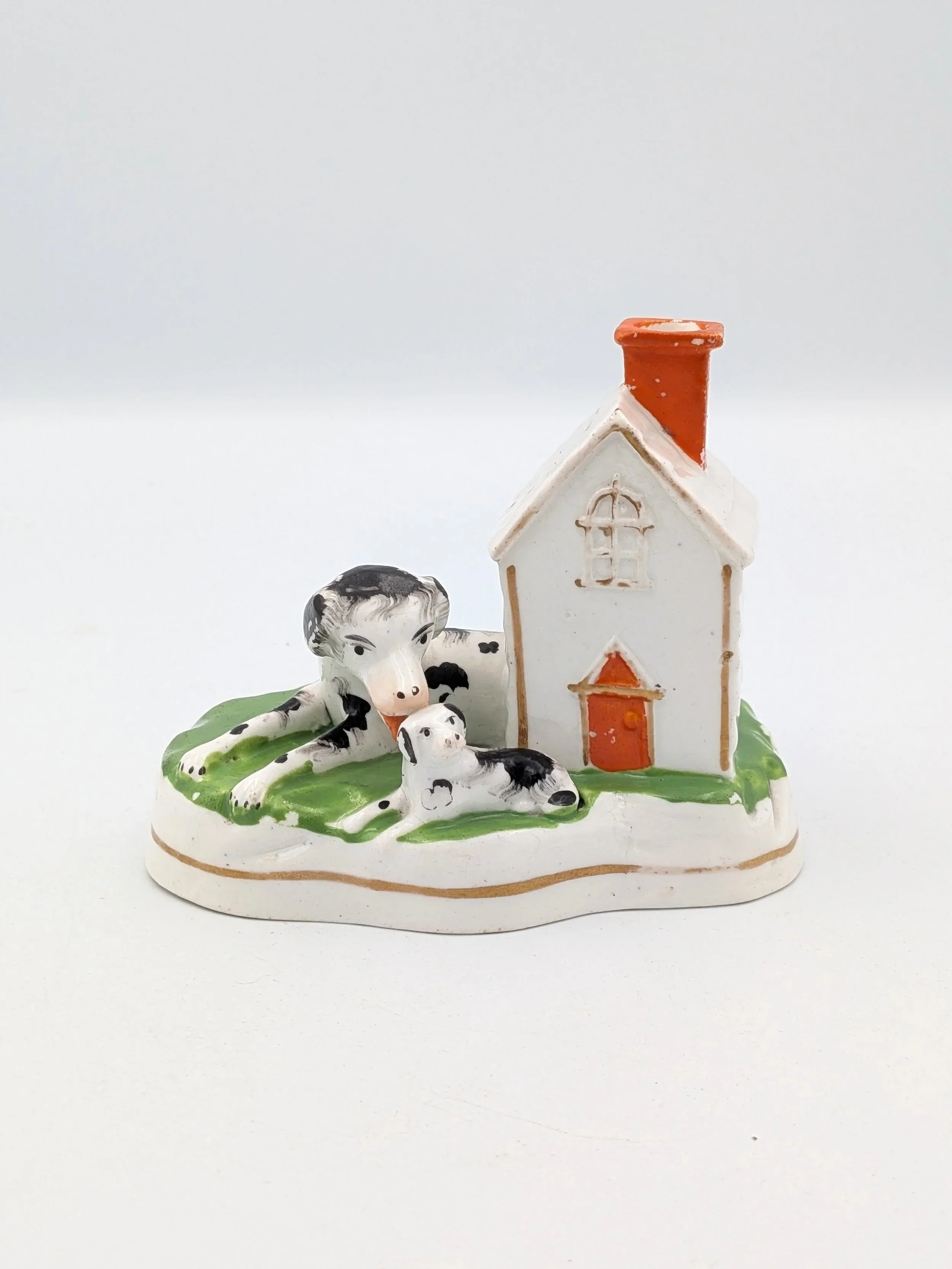 Dog and Puppy by a Kennel