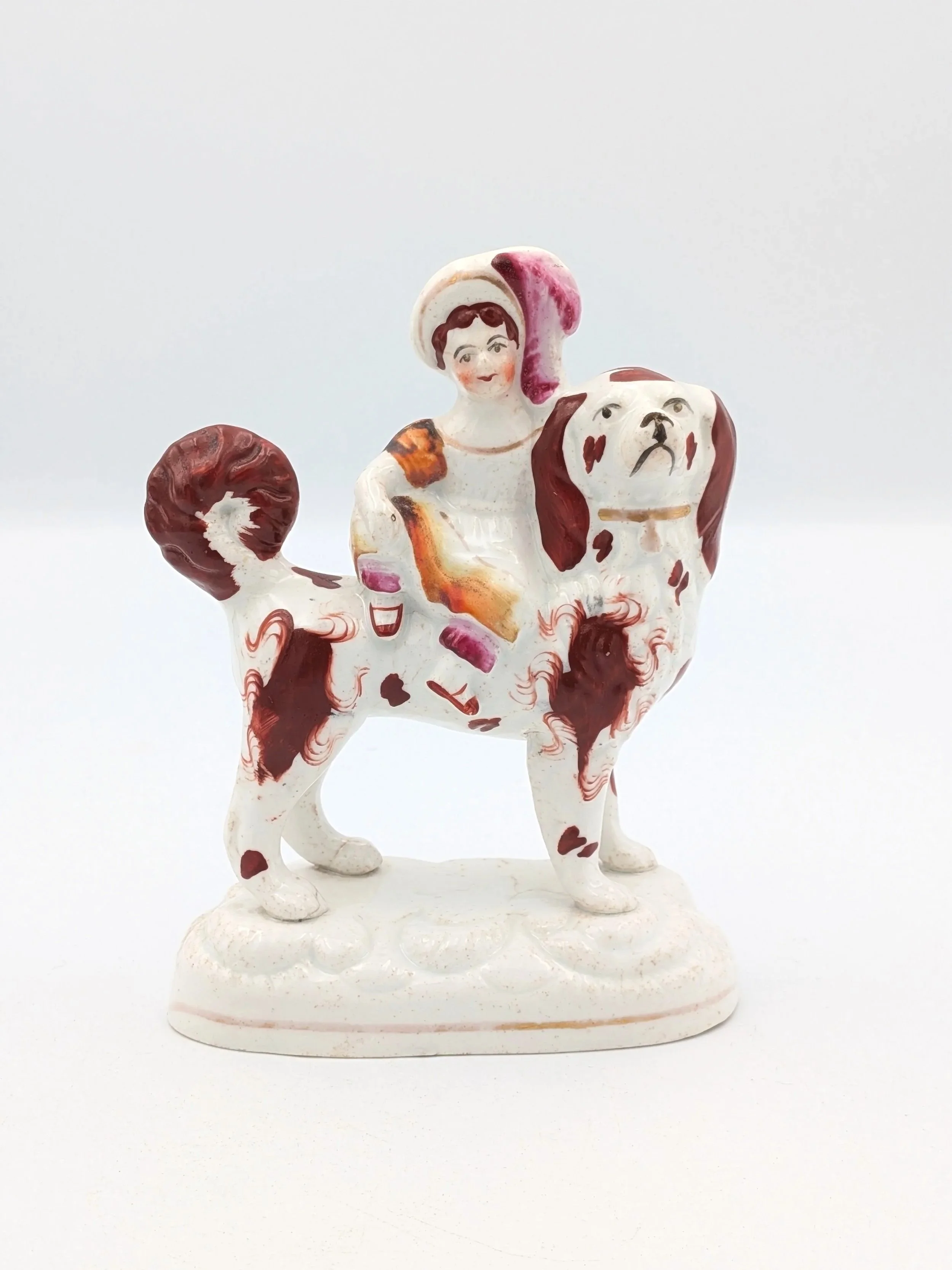 Girl Riding a Spaniel