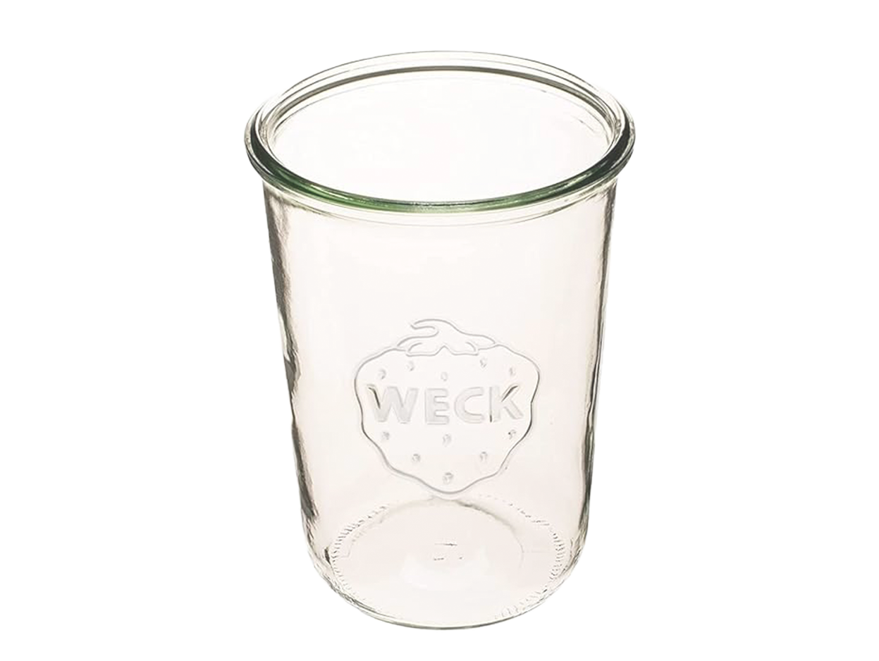 Empty glass jar with a strawberry design and the words "WECK" embossed on it.