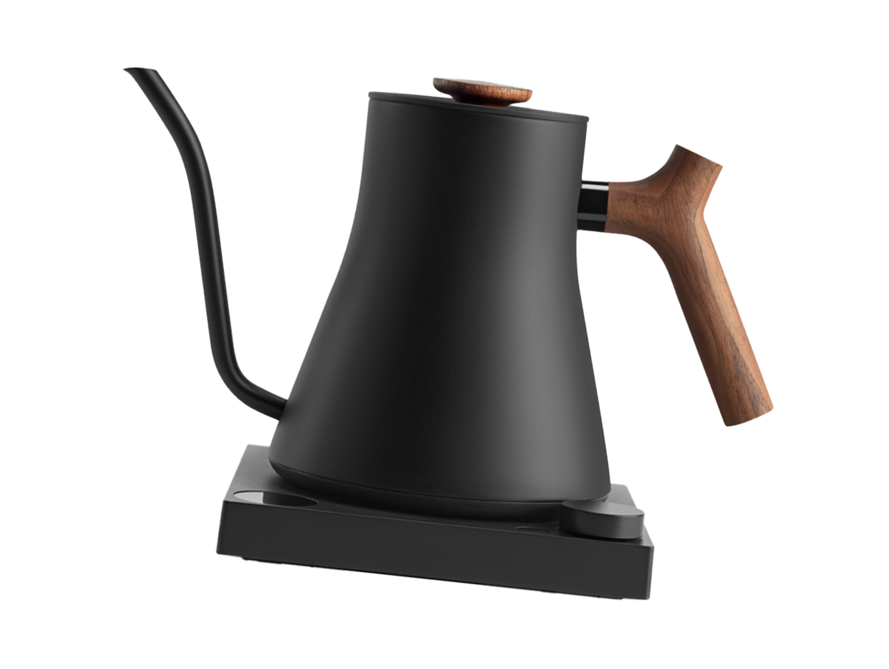 Black electric kettle with a wooden handle and a matching wooden lid, placed on a black base.