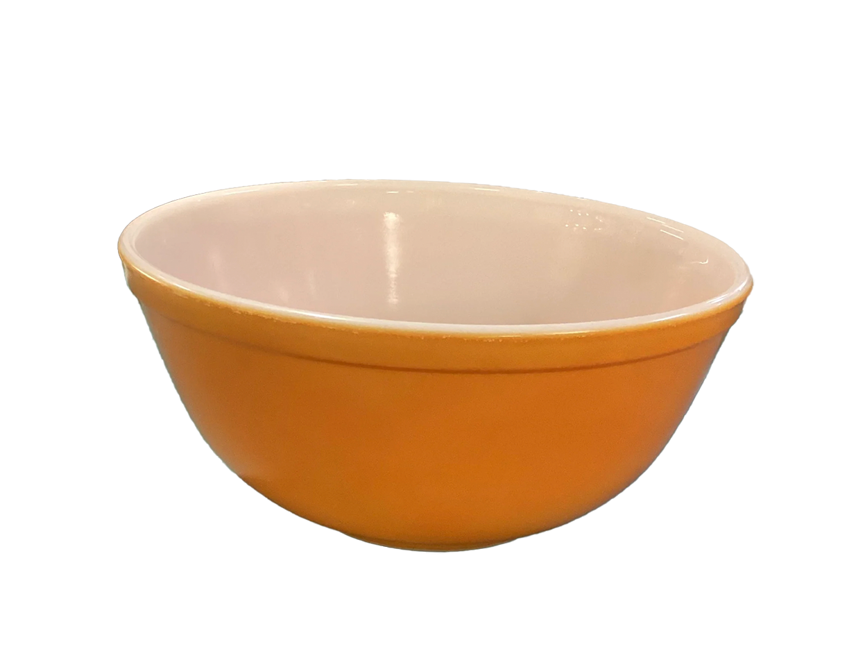 Orange ceramic bowl with a white interior.