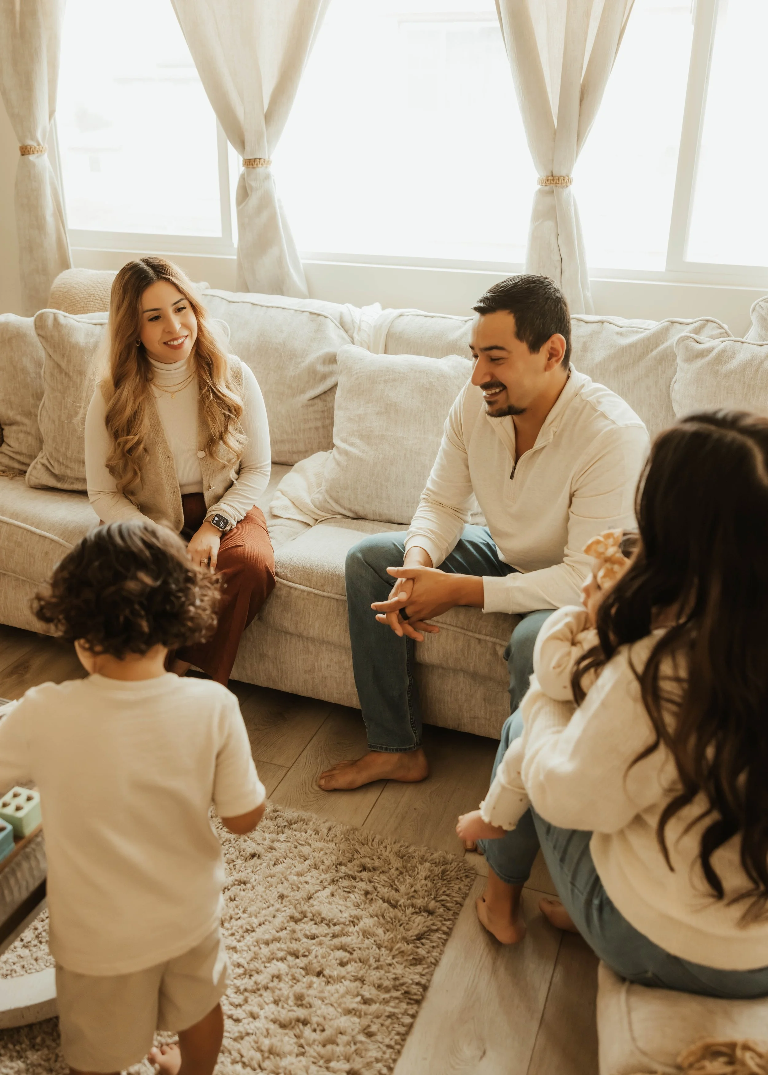 Dr. Salena Gallegos, OTD, OTR/L, connecting with families in a warm, welcoming environment that reflects relationship-centered care, family wellness, emotional support, and holistic occupational therapy through Root & Rhythm Holistic Care.