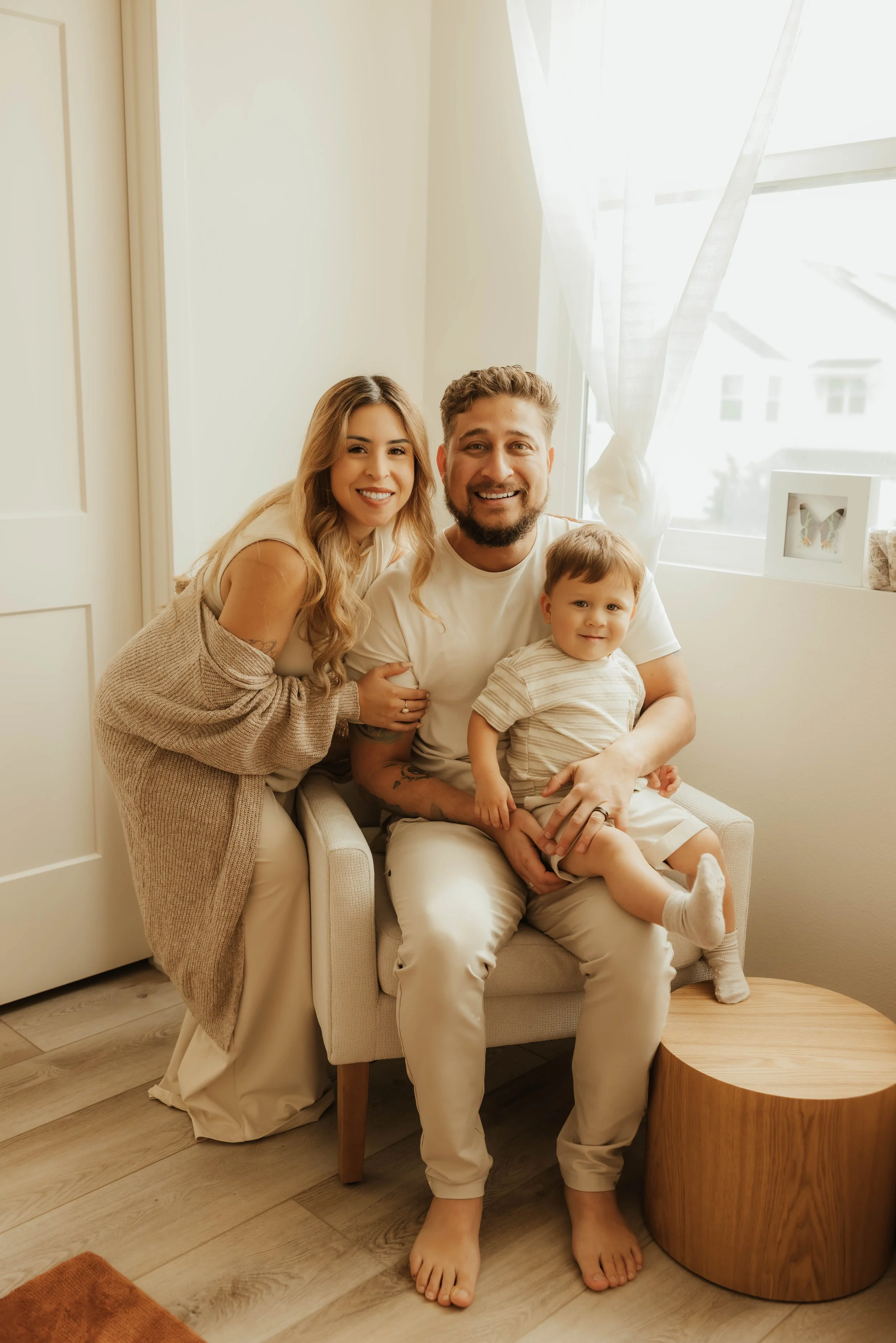 Dr. Salena Gallegos, OTD, OTR/L, with her family in a warm, connected space that reflects motherhood, family wellness, meaningful relationships, and the heart behind Root & Rhythm Holistic Care.