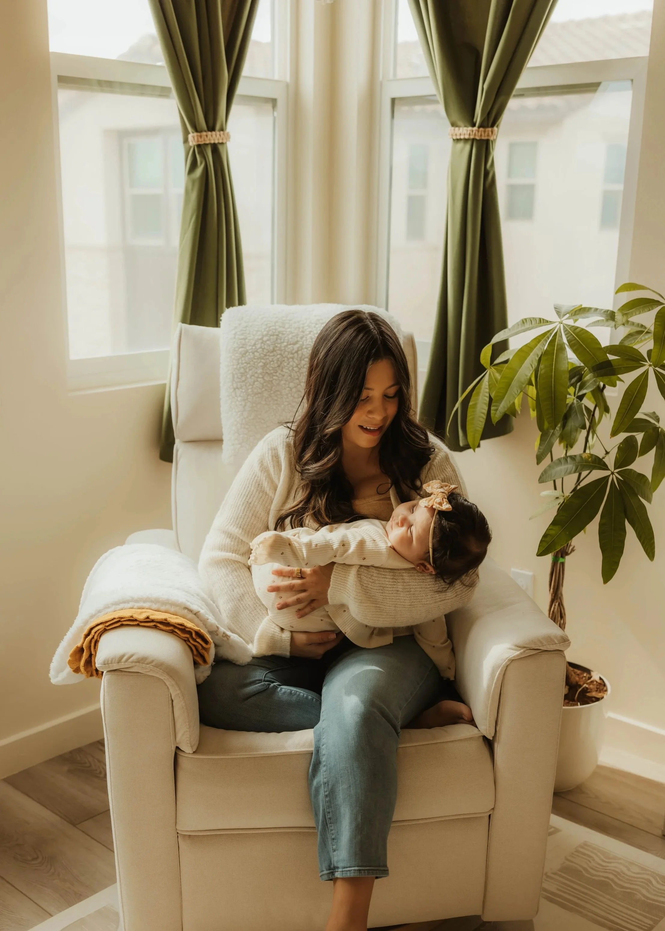 A mother and baby sharing a calm, loving moment that reflects connection, nurturing care, emotional wellness, and the heart of holistic family support through Root & Rhythm Holistic Care.