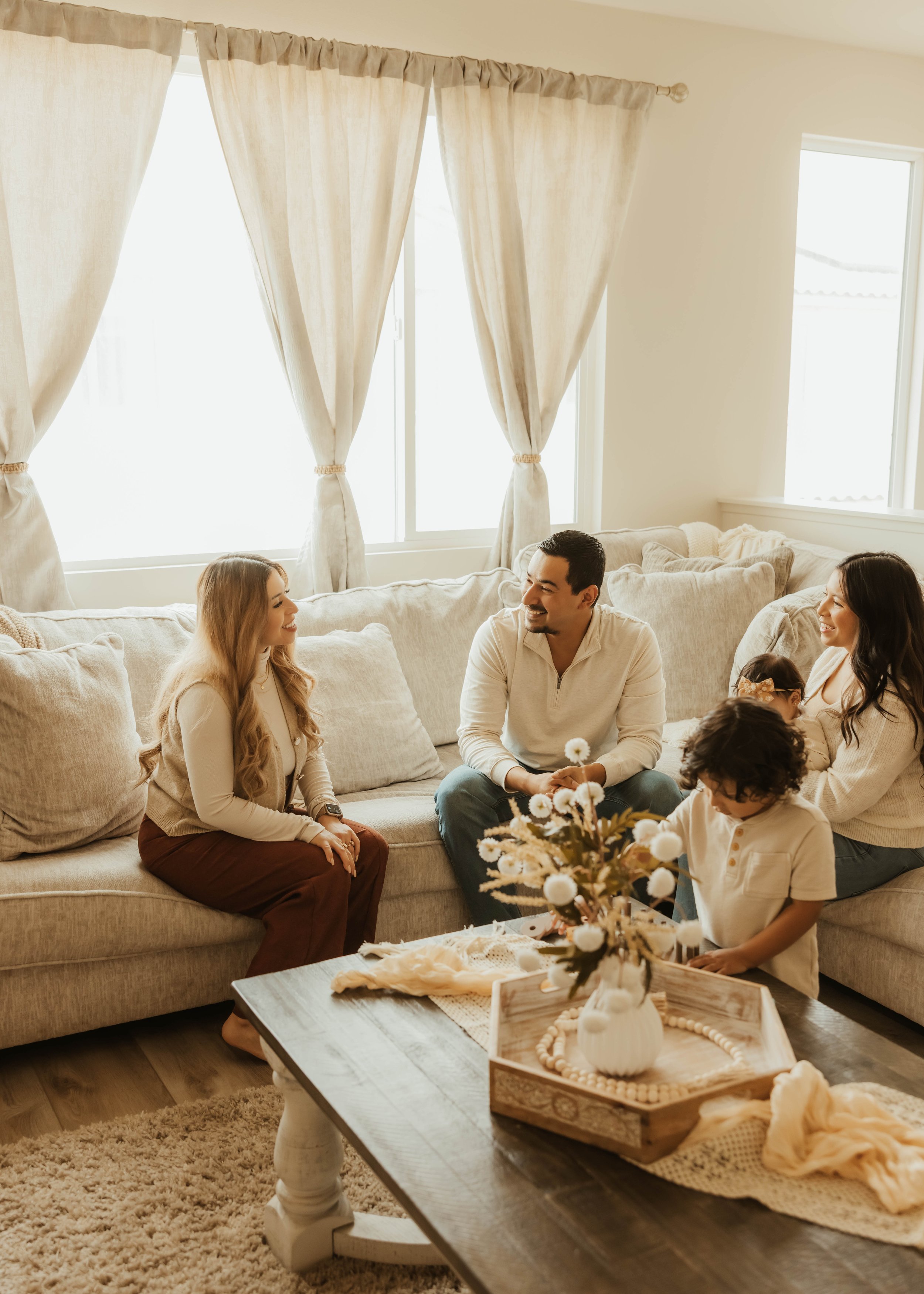 Dr. Salena Gallegos, OTD, OTR/L, working with a family in a warm, supportive environment that reflects connection, family wellness, everyday routines, and compassionate occupational therapy through Root & Rhythm Holistic Care.