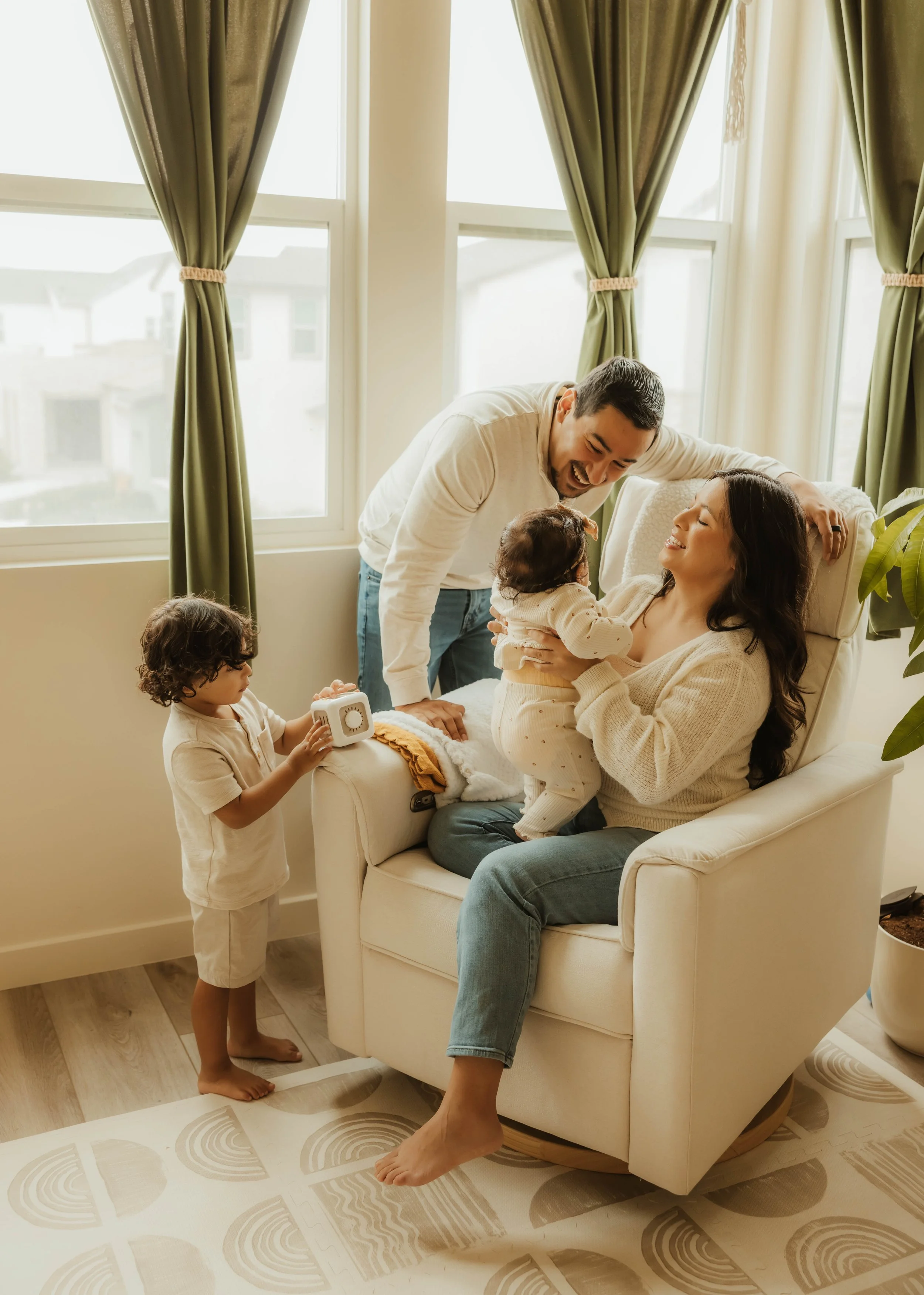 A family spending meaningful time together in a warm, connected environment that reflects play, caregiving, emotional wellness, and the everyday moments supported through holistic occupational therapy at Root & Rhythm Holistic Care.