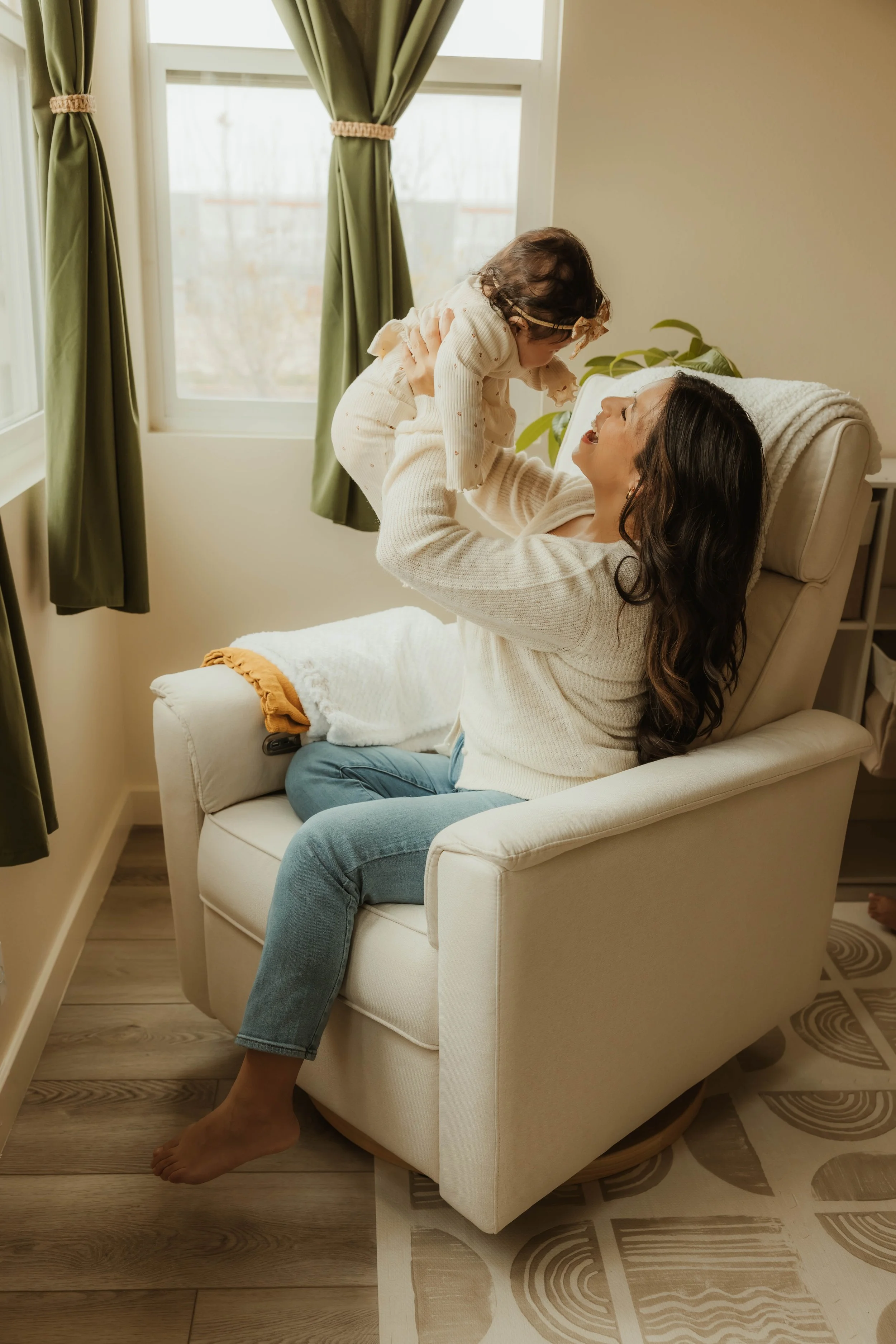 A mother and child sharing a joyful moment that reflects connection, nurturing relationships, emotional wellness, and the heart of holistic family-centered care through Root & Rhythm Holistic Care.