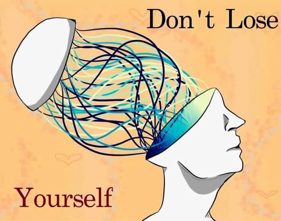 A person's head with a white cap removed, showing tangled wires inside that connect to the brain area, with the words "Don't Lose Yourself" in the image.