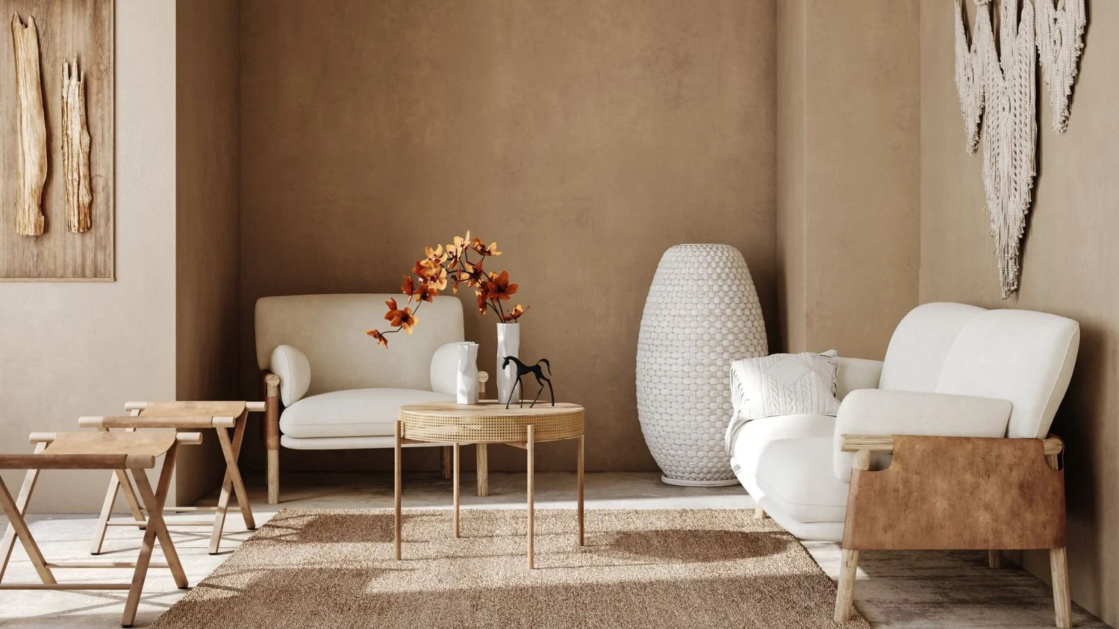 Modern living room with beige walls, white sofa, armchair, decorative vase with orange flowers, woven floor lamp, and artwork on the wall.