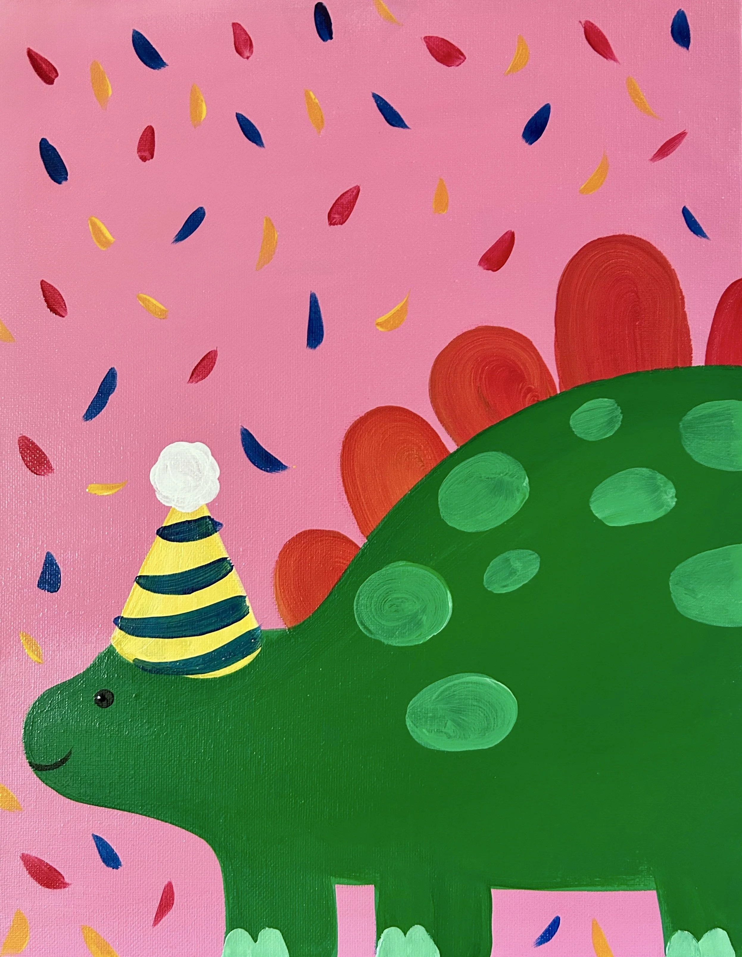 Up close photo of a green dinosaur with polka dots and orange humps and a yellow party hat on a pink background surrounded by colorful confetti