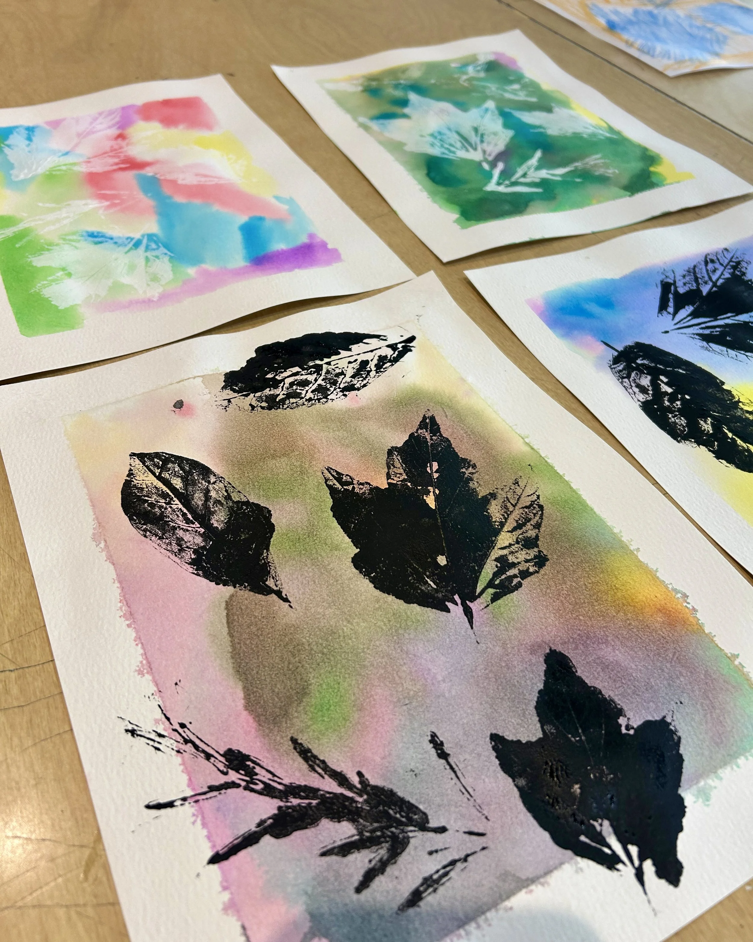 Up close photos of leaf print paintings