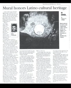A newspaper article about a mural honoring Latino cultural heritage, featuring an image of the mural showing a face, a person, and a circular design. The article discusses the significance of the mural and its creator.