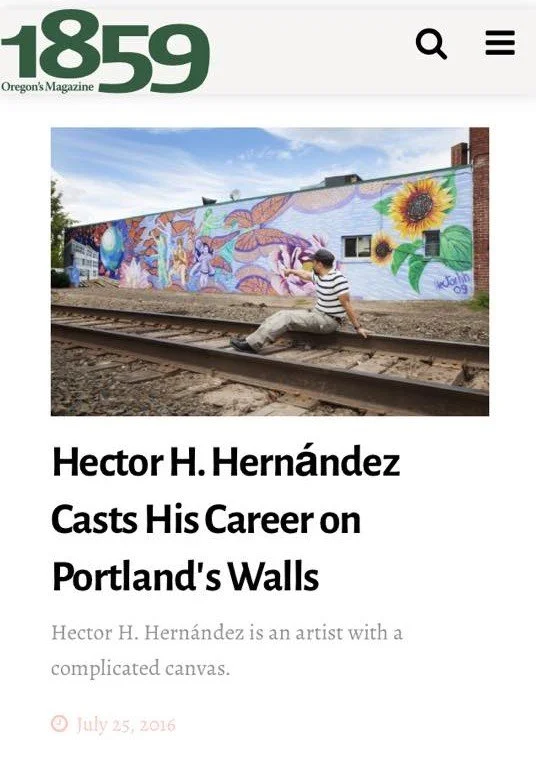 A colorful mural painted on the side of a building featuring sunflowers, a butterfly, and abstract designs, with a man sitting on a railroad track in front.
